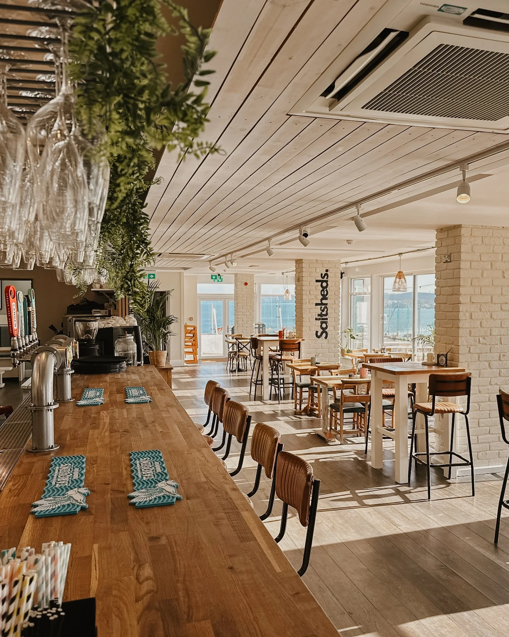A scene from Saltsheds restaurant in Newquay, with fresh beachy bistro vibes, an example of work for social media management by Leah Croft
