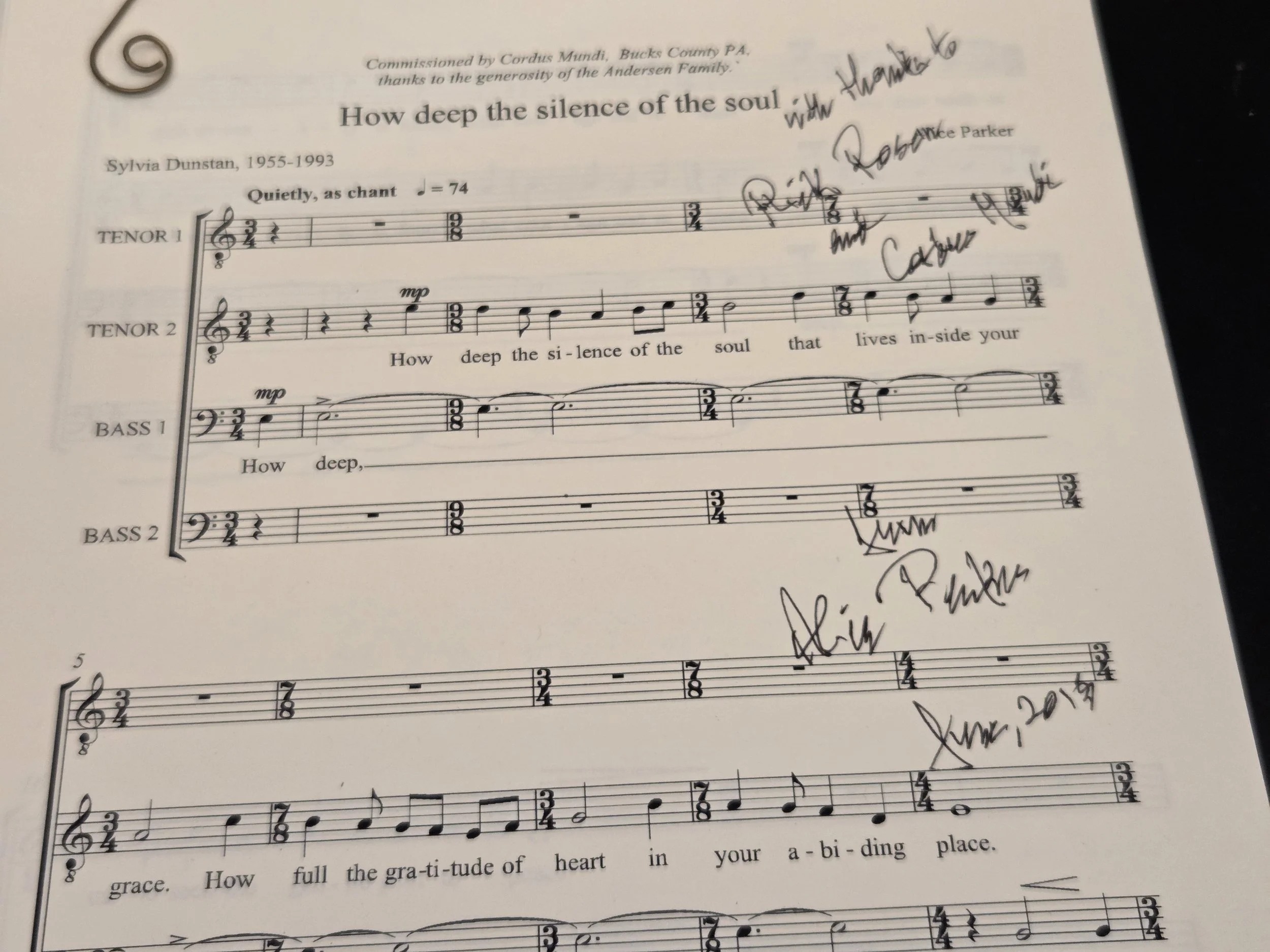 The image shows a sheet of music titled "How deep the silence of the soul," with handwritten notes and signatures on it. The music is for a vocal piece with parts labeled Tenor 1, Tenor 2, Bass 1, and Bass 2.