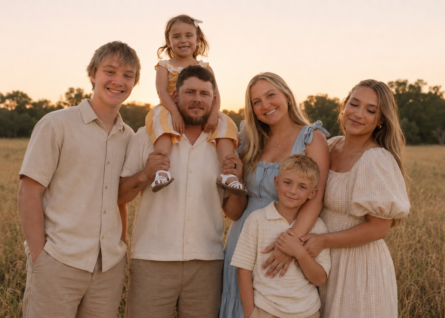 Birdie Smith with her family at sunset in a Texas field