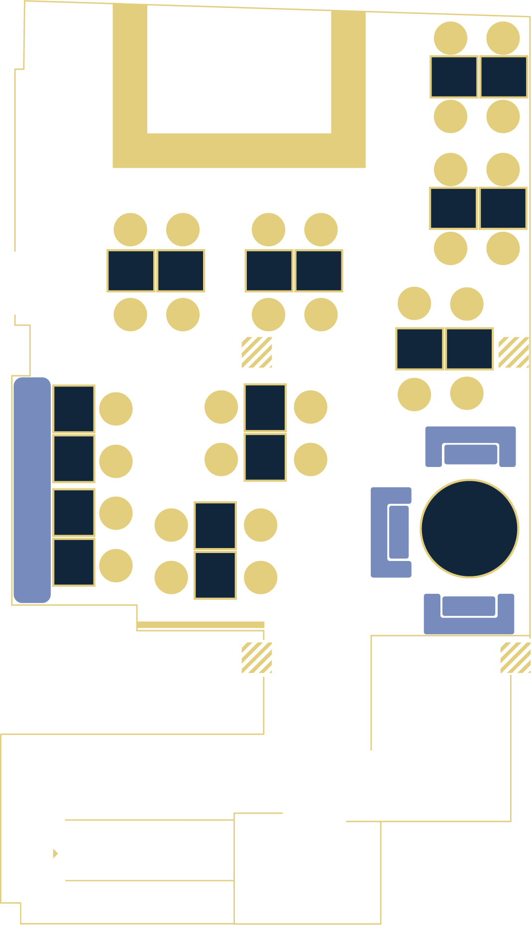 Floor plan of a building interior featuring multiple seating areas, a kitchen, and a bathroom, with a central entrance.