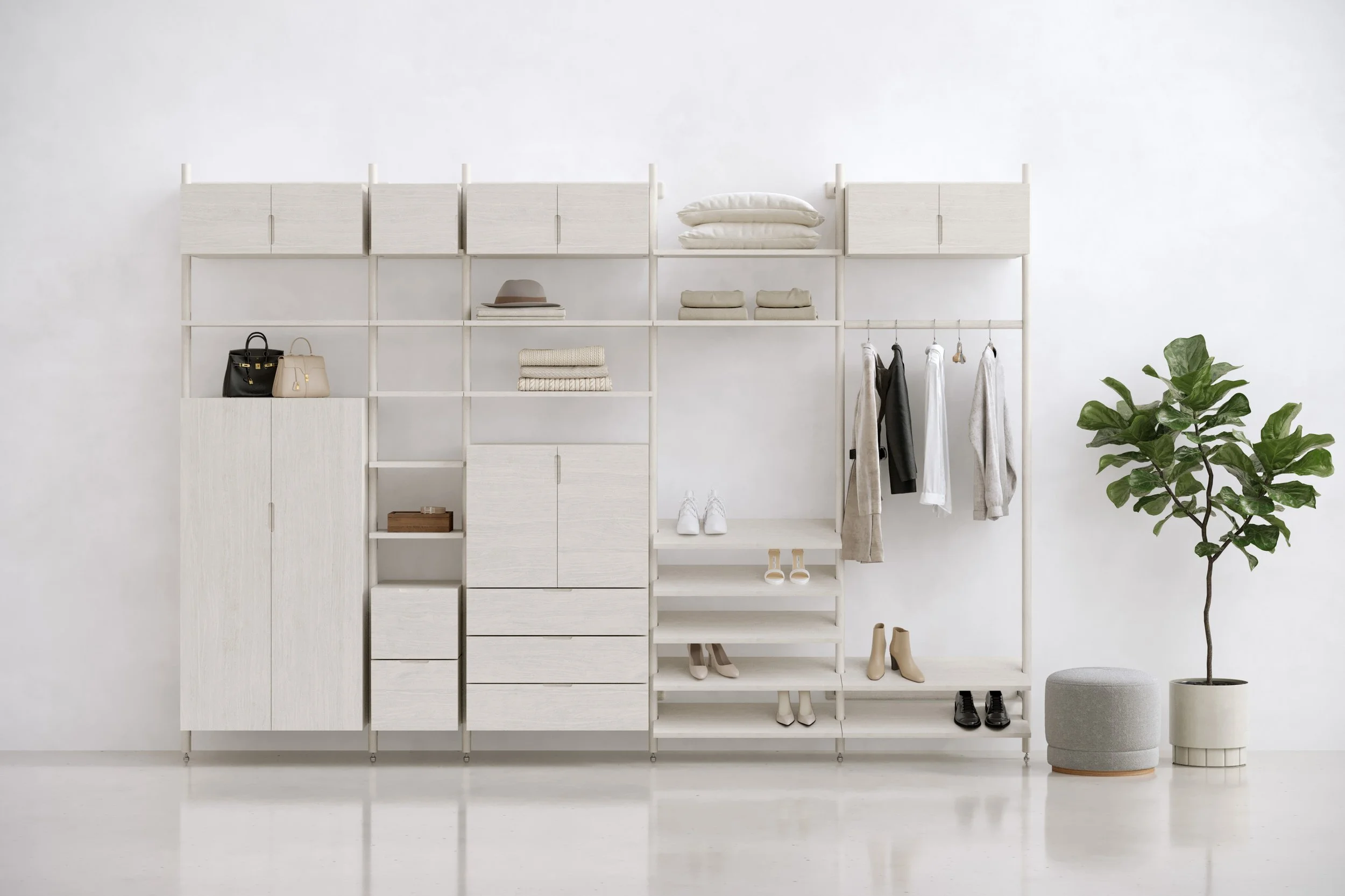 Minimalist white shelving unit with clothes, handbags, shoes, and hats, next to a potted green plant in a modern interior.