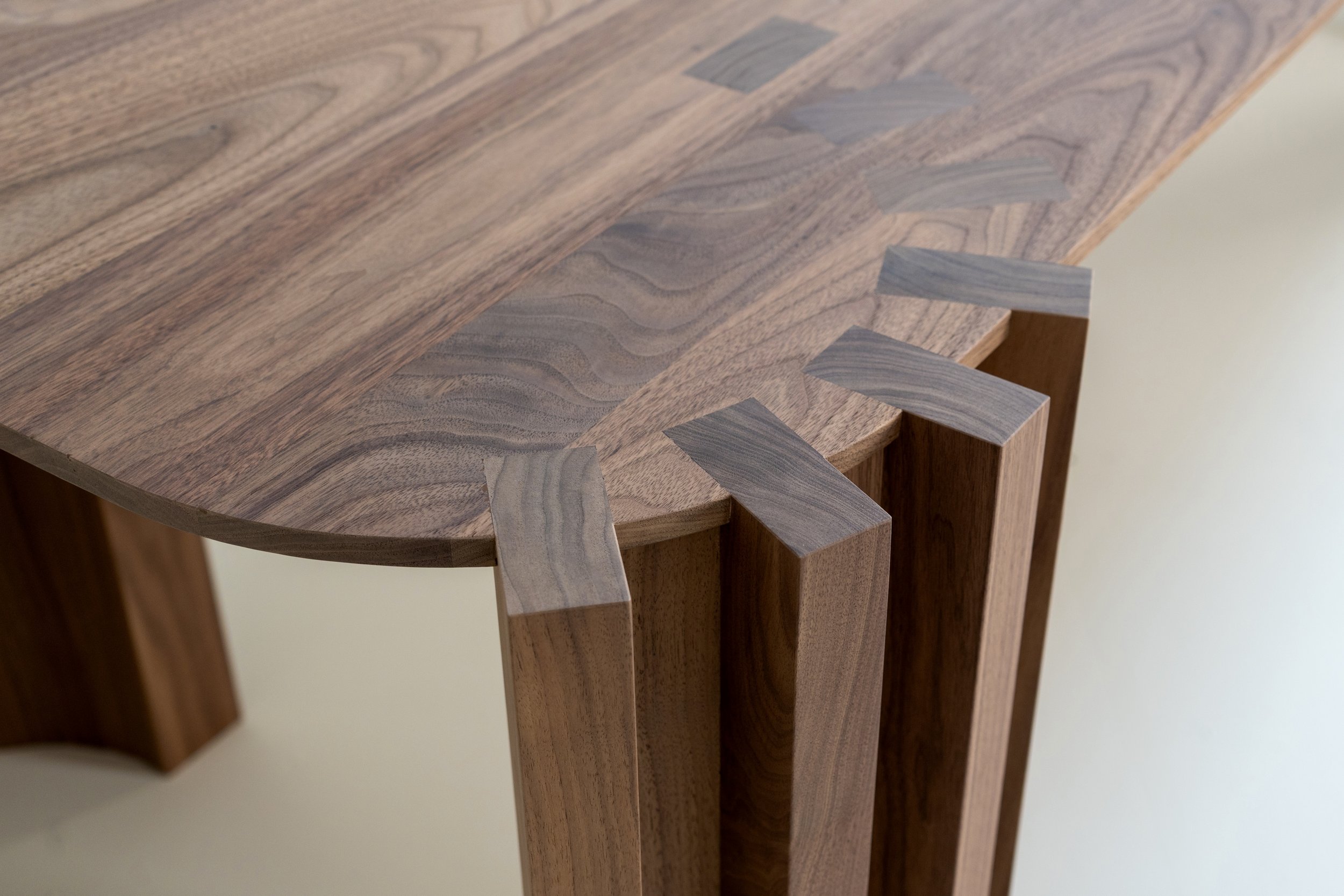 Close-up of a wooden table with a butterfly joint detail.