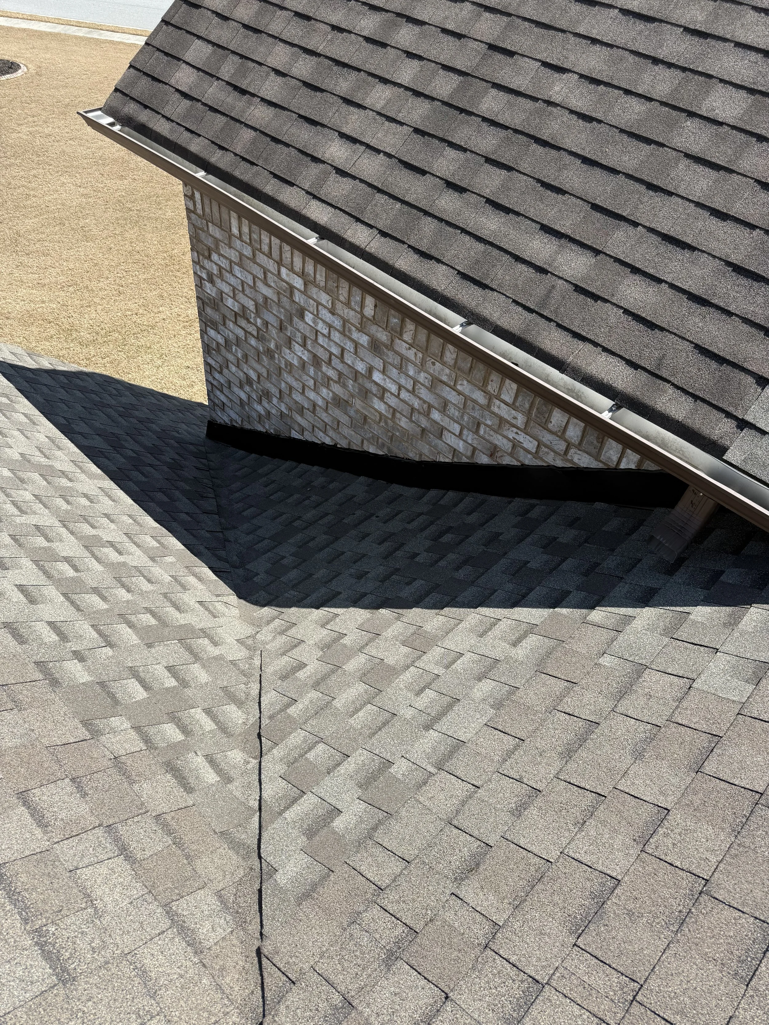 Roof repair on an asphalt shingle roof in Metro Atlanta