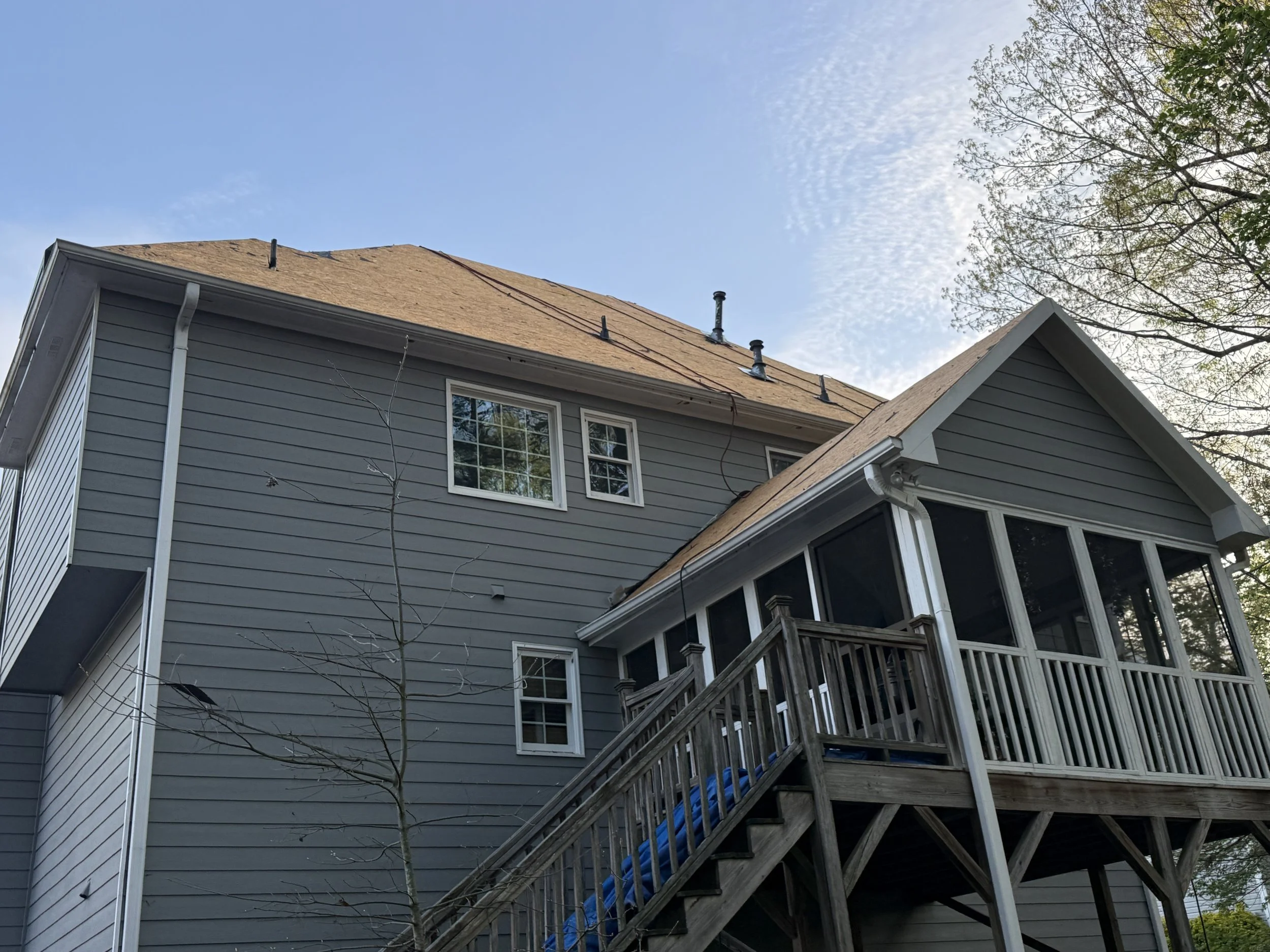 New shingles being installed during a roof replacement