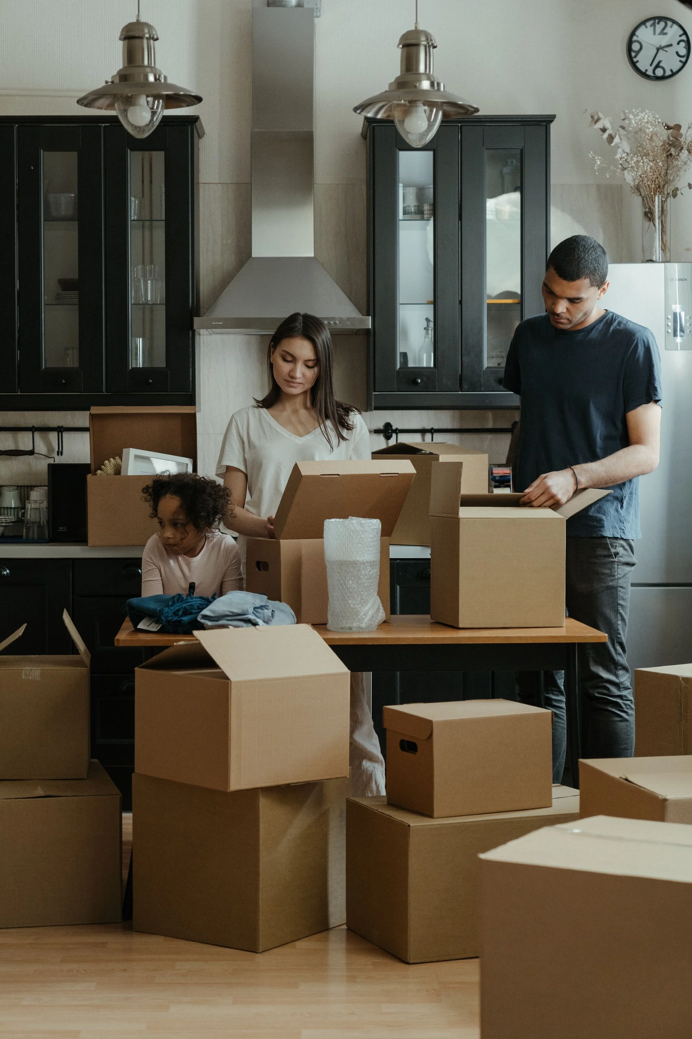 Moving boxes representing relocation to West Michigan