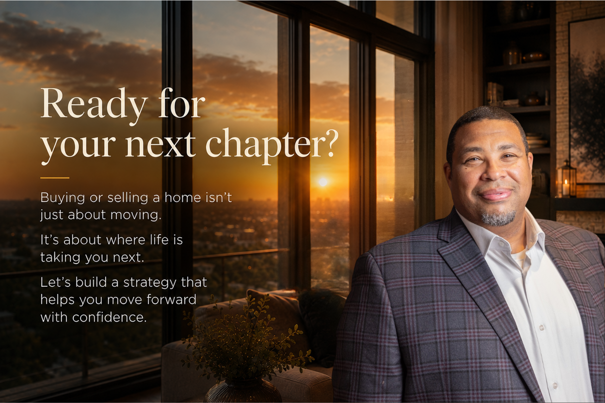 A man in a plaid suit jacket and white shirt smiling inside a modern apartment with large windows showing a sunset over a city skyline.