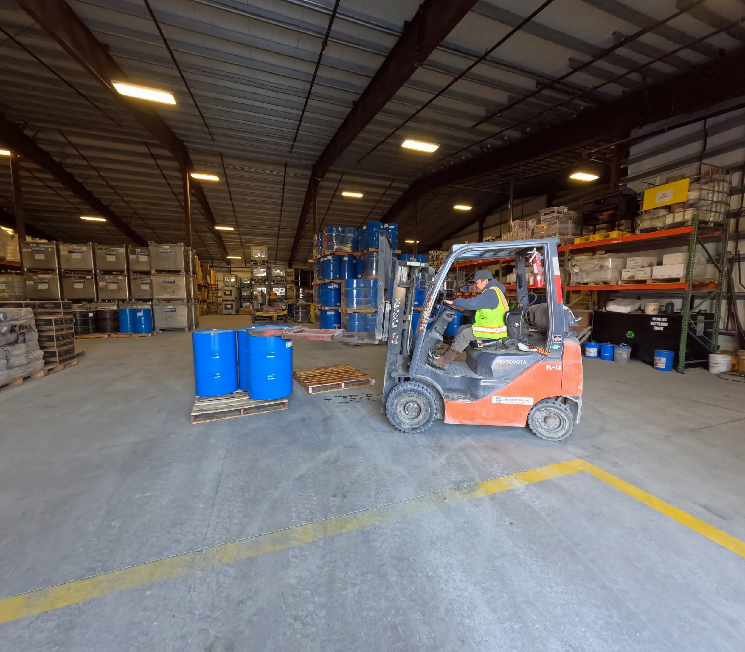 Delta Western worker driving fork lift