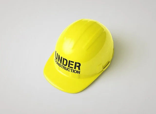Yellow hat that says under construction