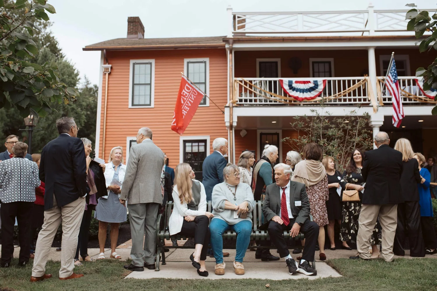Guests gathered on the lawn outside the decorated inn.