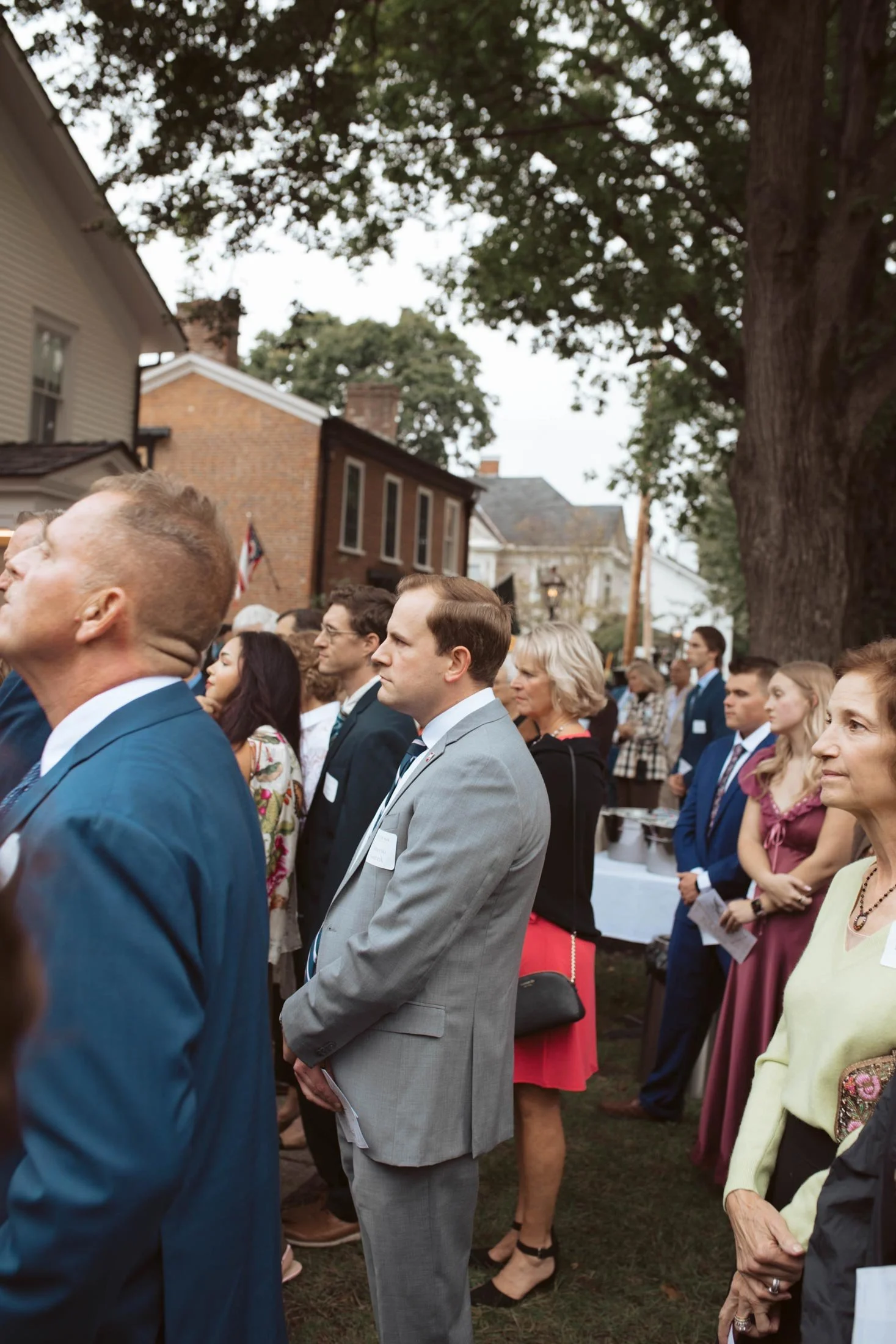 A crowd of guests listening to the remarks.