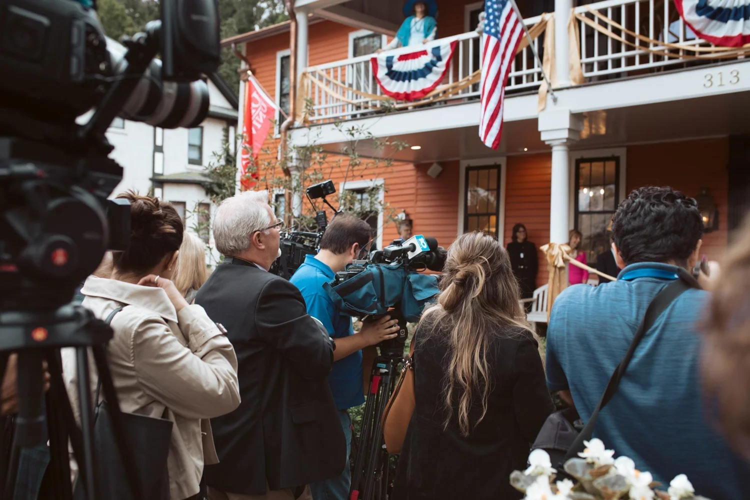 Camera crews and guests documenting the celebration.
