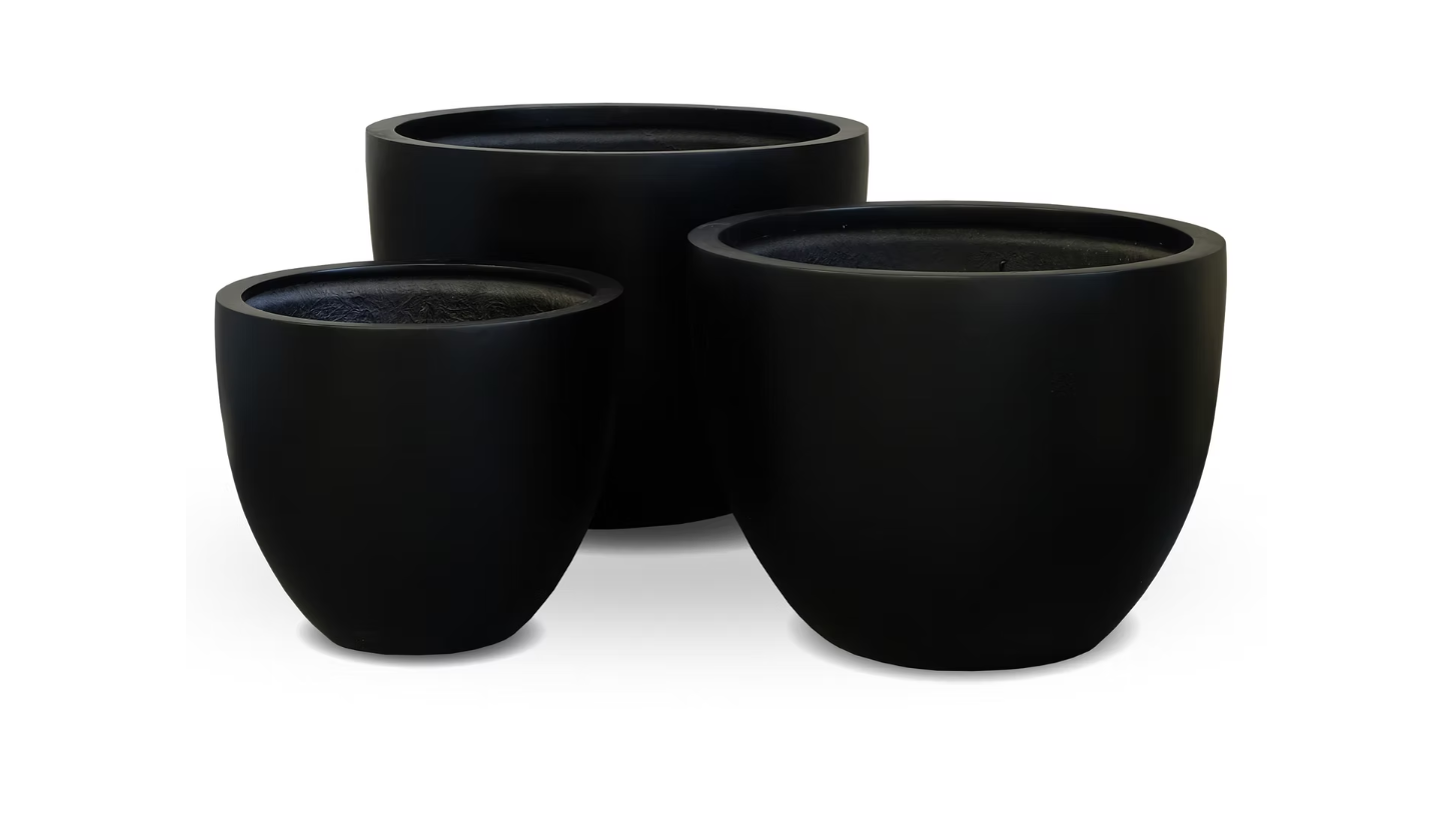 Three black round planters of different sizes on a white background.