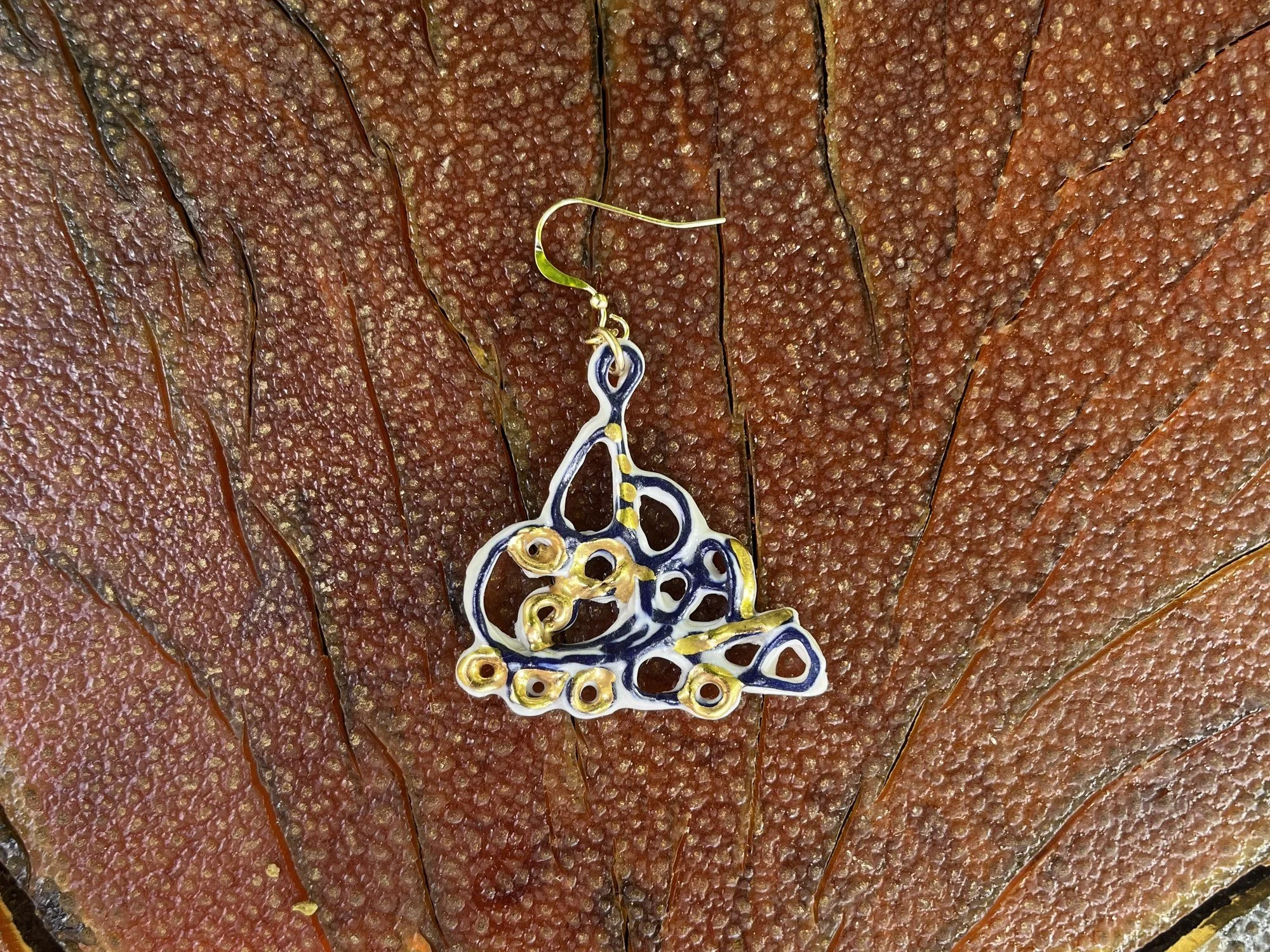 Hand-crafted porcelain earring No. 007 with cobalt blue line work and gold luster detail