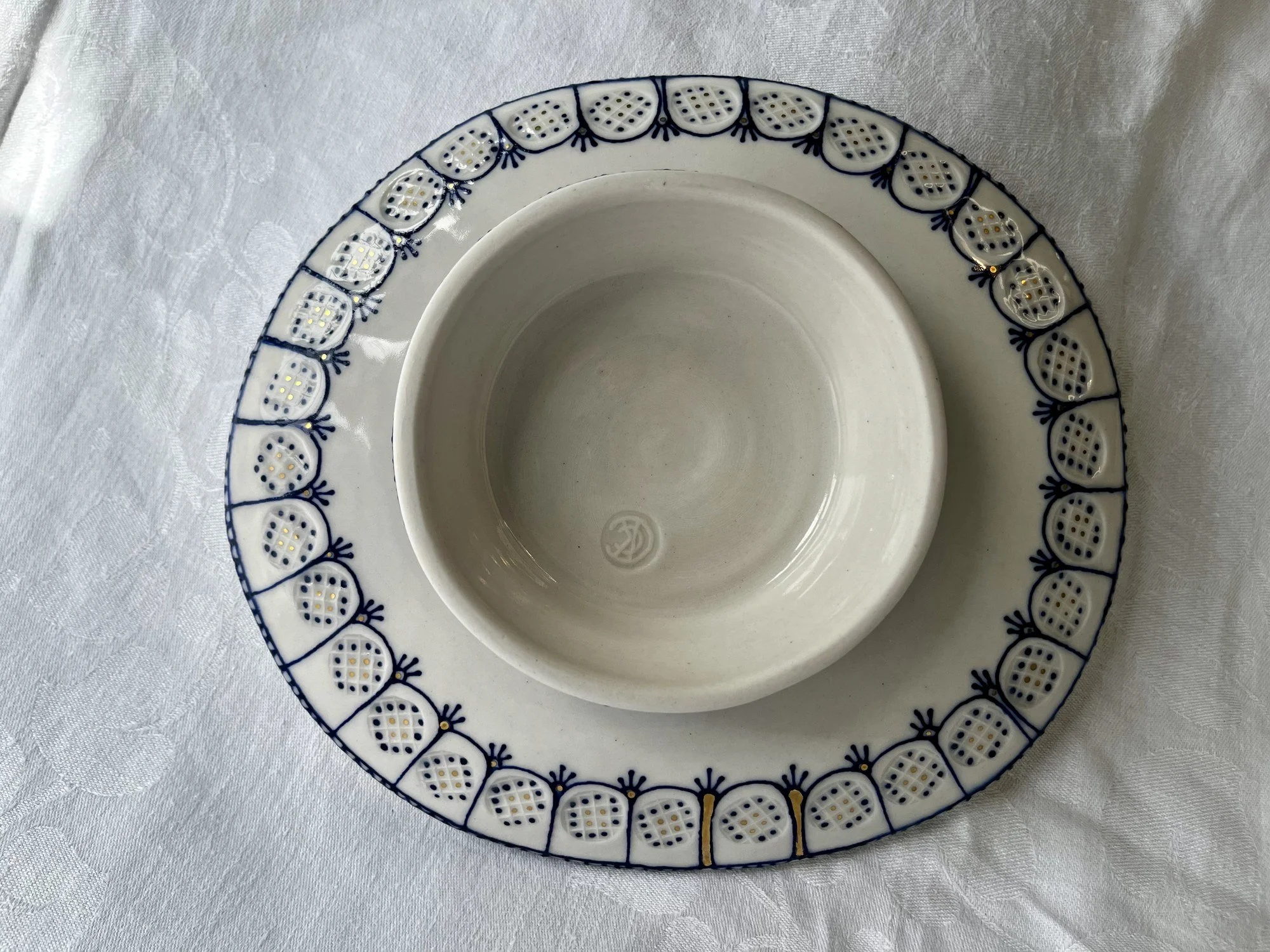 Underside of hand-thrown porcelain serving dish No. 002, made in Naples, Florida