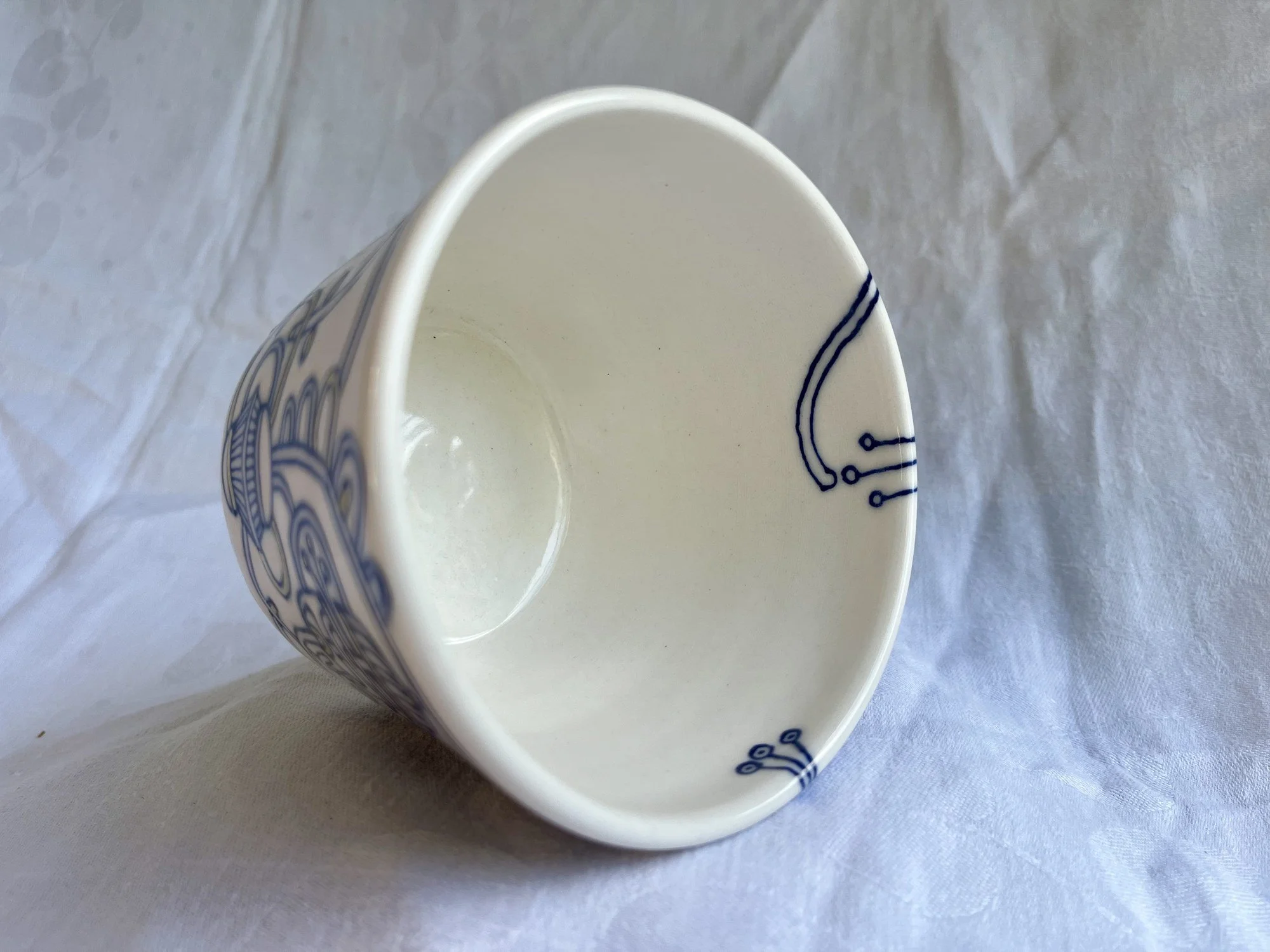 Interior of wheel-thrown porcelain tumbler No. 002, hand-painted in Naples, Florida