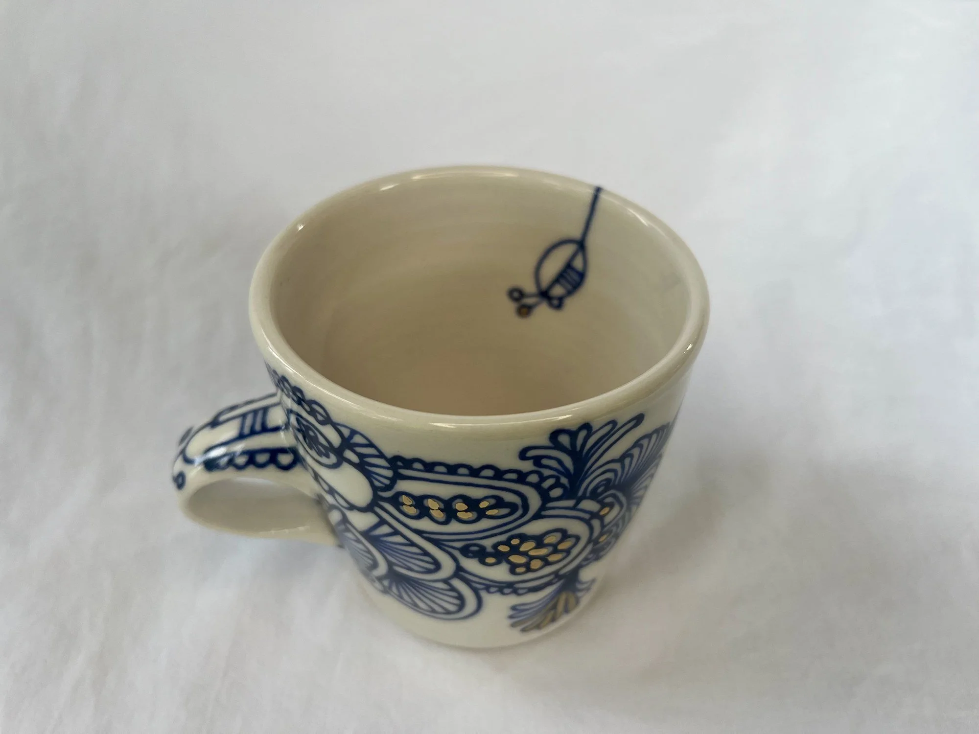 Cobalt blue line work and gold luster detail on handmade porcelain mug No. 021