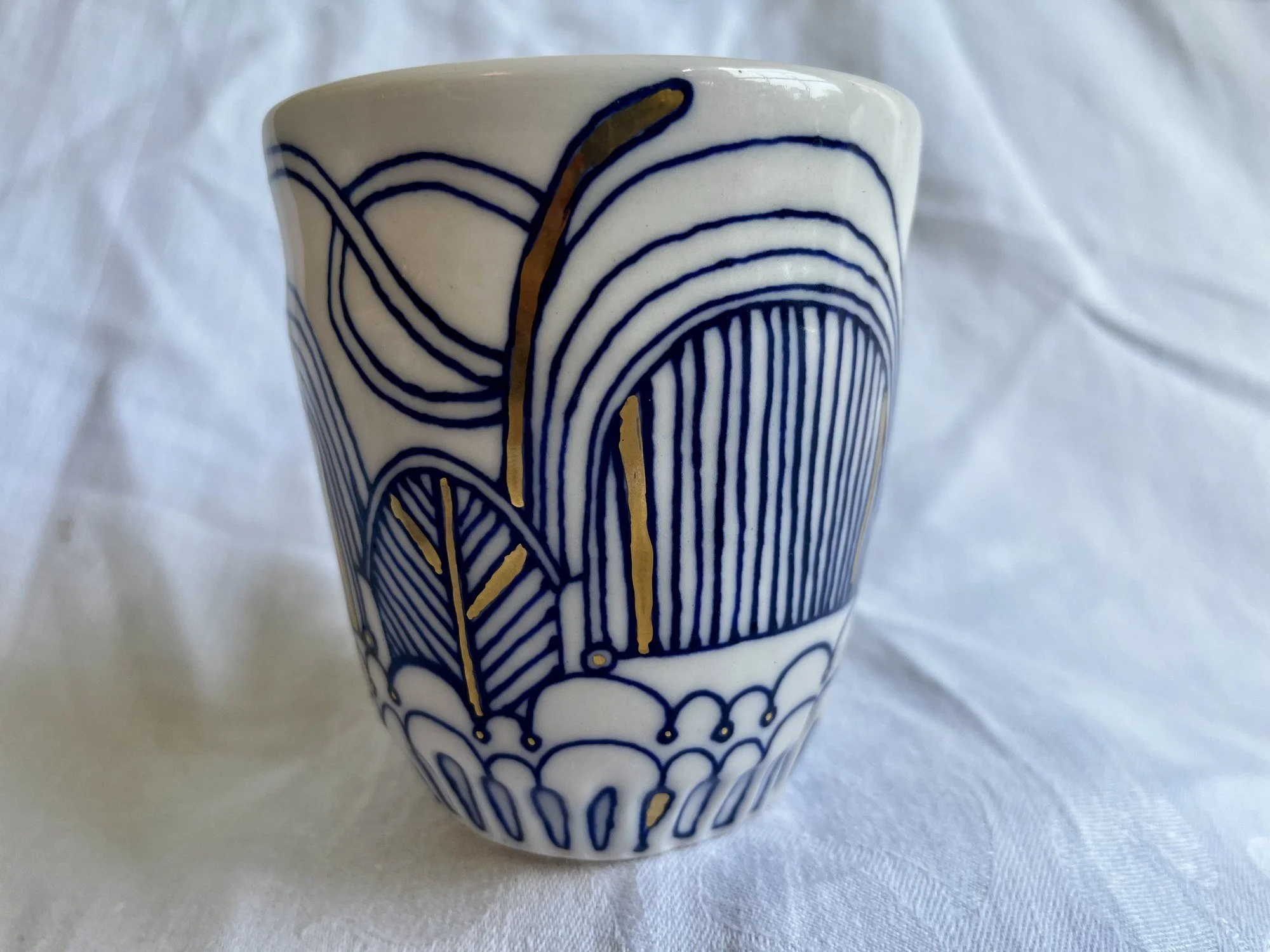 Hand-painted cobalt blue and gold luster porcelain tumbler No. 003 by Cypress Knees Ceramics