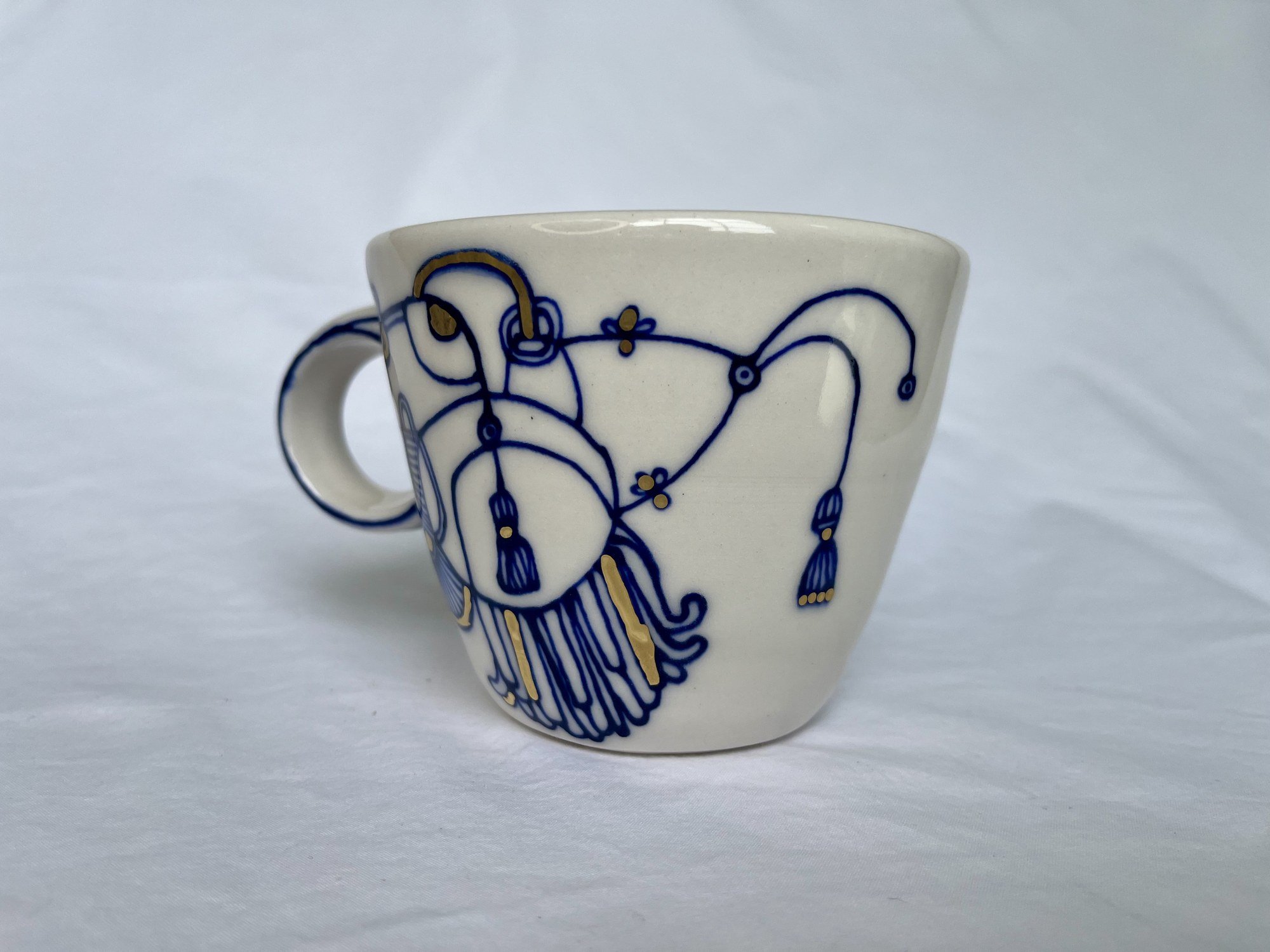 Cobalt blue line work and gold luster detail on handmade porcelain mug No. 005