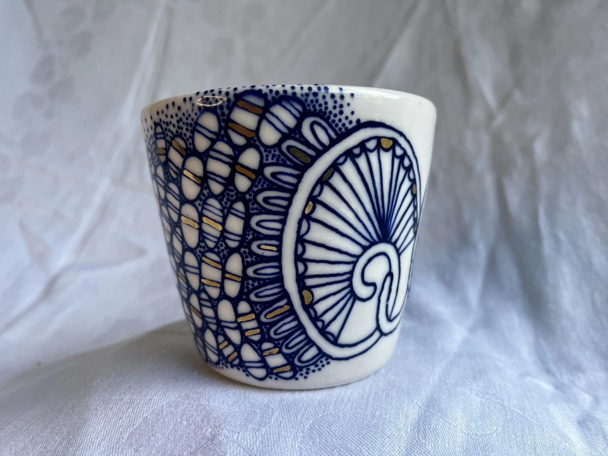 Hand-painted cobalt blue and gold luster porcelain tumbler No. 001 by Cypress Knees Ceramics
