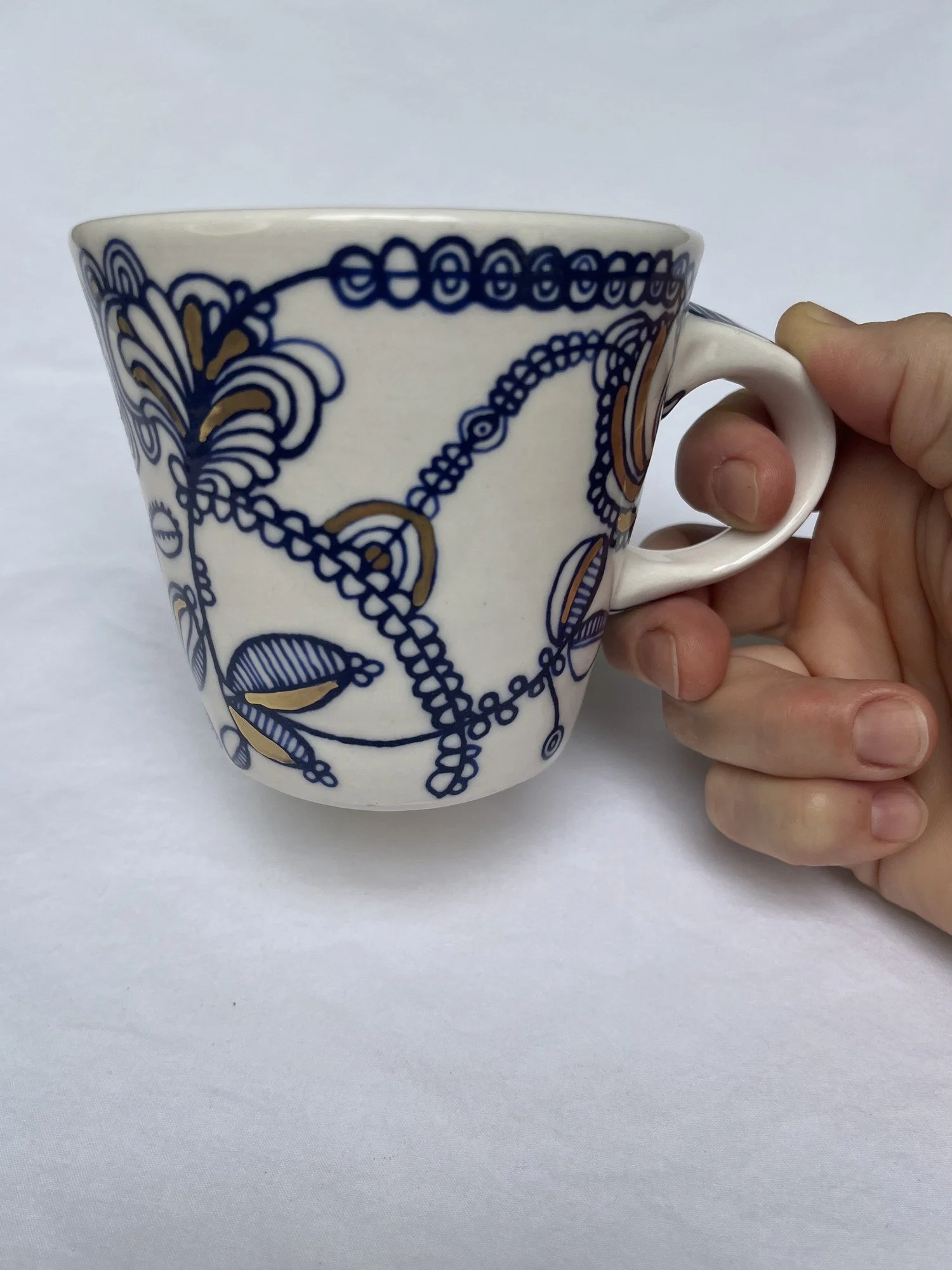 Cobalt blue line work and gold luster detail on handmade porcelain mug No. 001