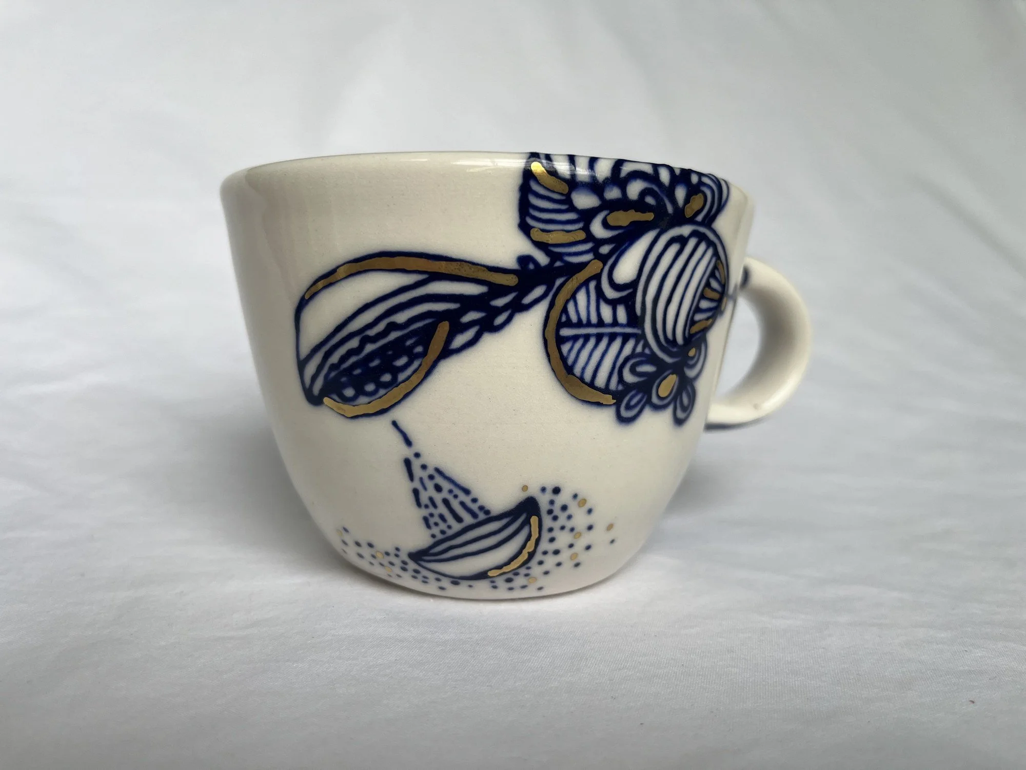 Cobalt blue line work and gold luster detail on handmade porcelain mug No. 014