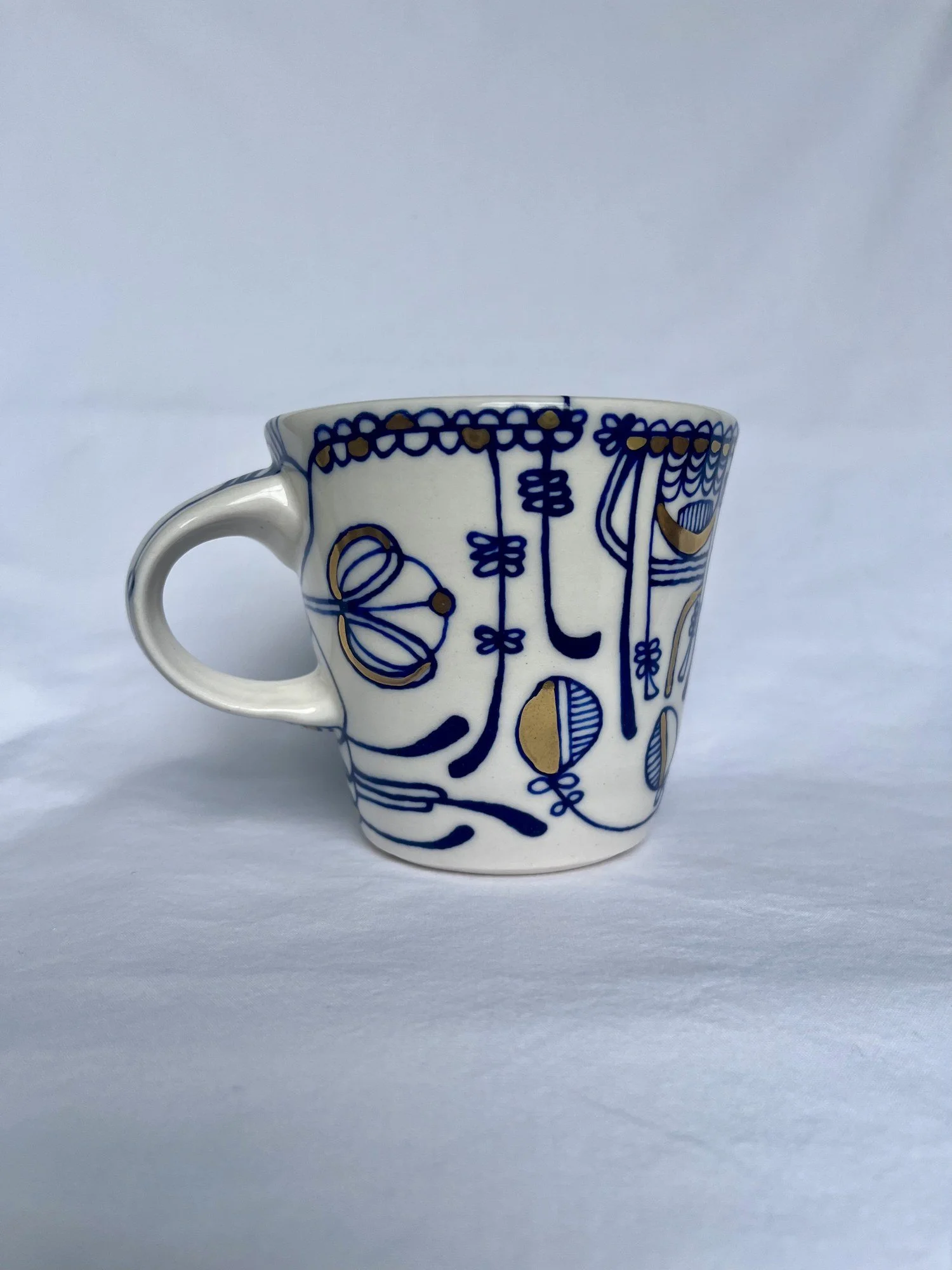 Hand-painted cobalt blue and gold luster porcelain mug No. 001 by Cypress Knees Ceramics