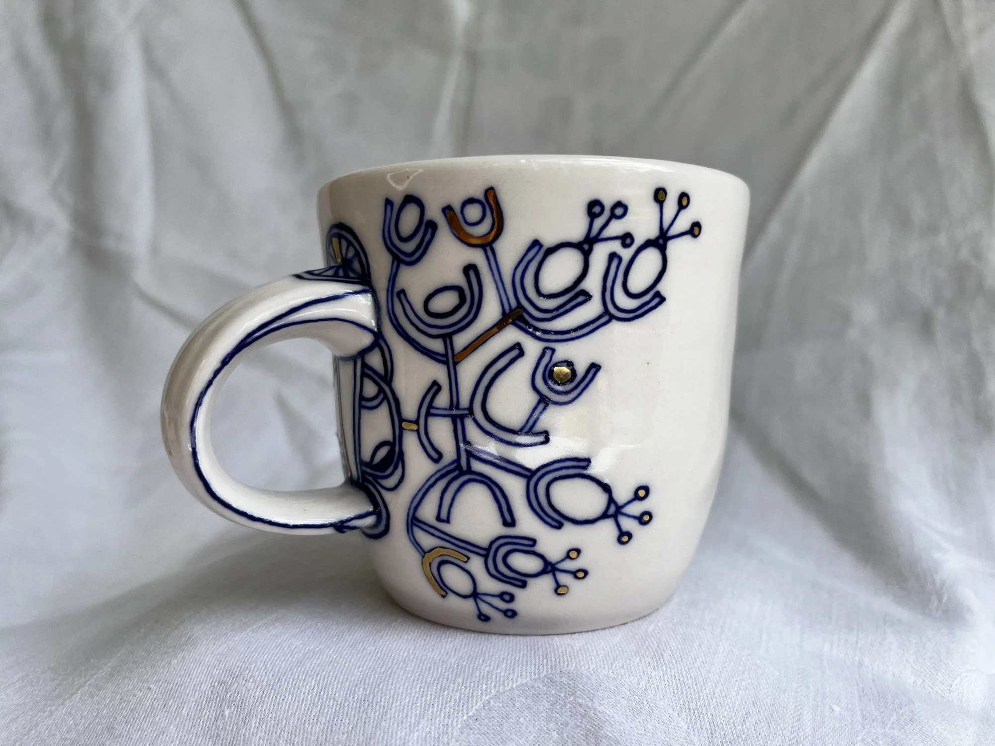 Cobalt blue line work and gold luster detail on handmade porcelain mug No. 030