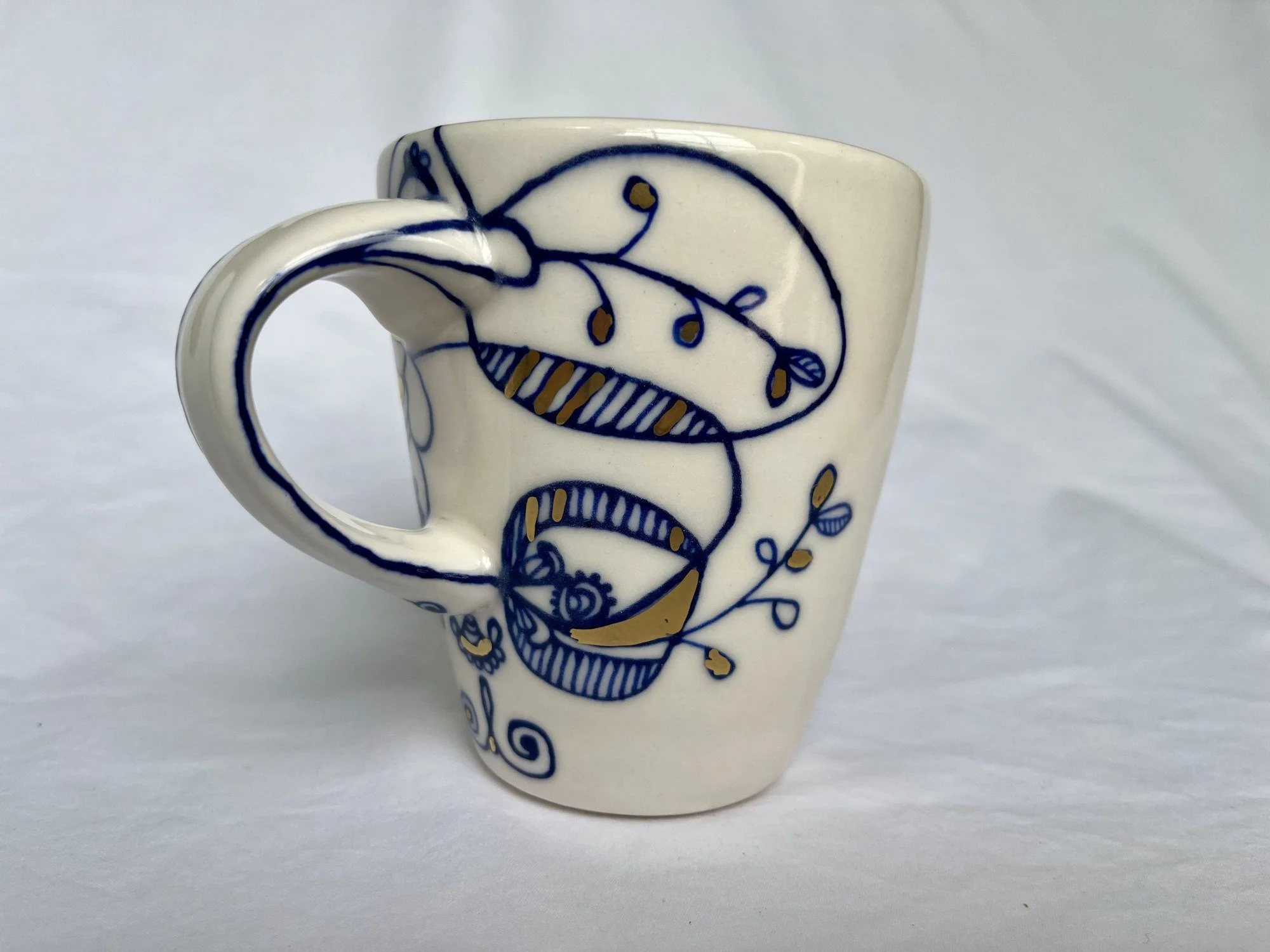Cobalt blue line work and gold luster detail on handmade porcelain mug No. 010