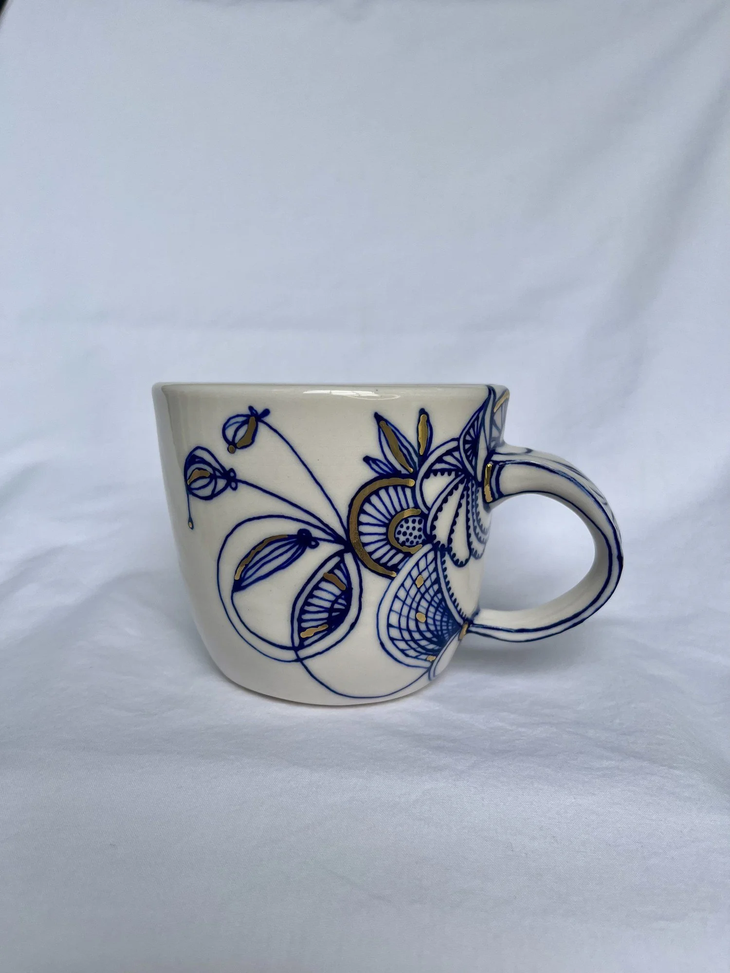 Cobalt blue line work and gold luster detail on handmade porcelain mug No. 003