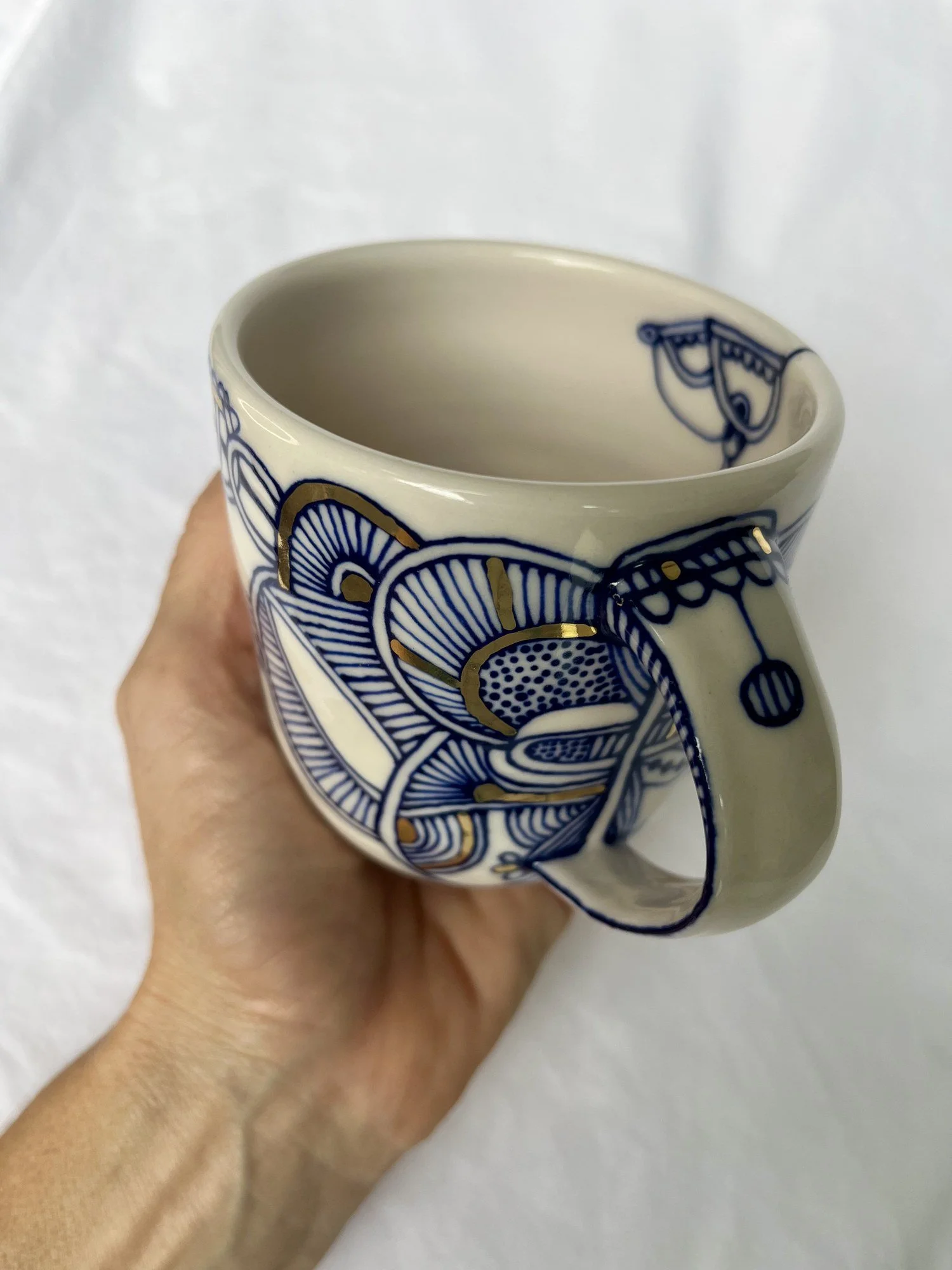 Further view of handmade porcelain mug No. 002 with cobalt blue and gold luster