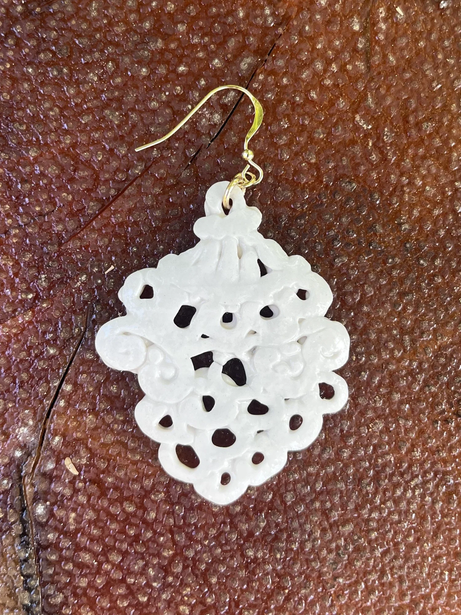 Back of handmade porcelain earring No. 001 on a 14k gold-filled ear wire