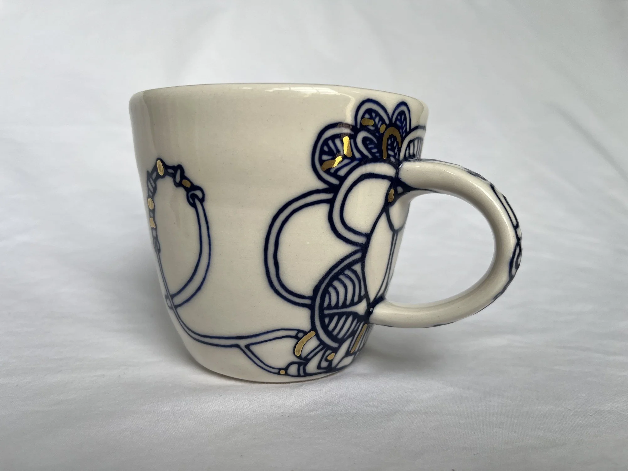 Cobalt blue line work and gold luster detail on handmade porcelain mug No. 018