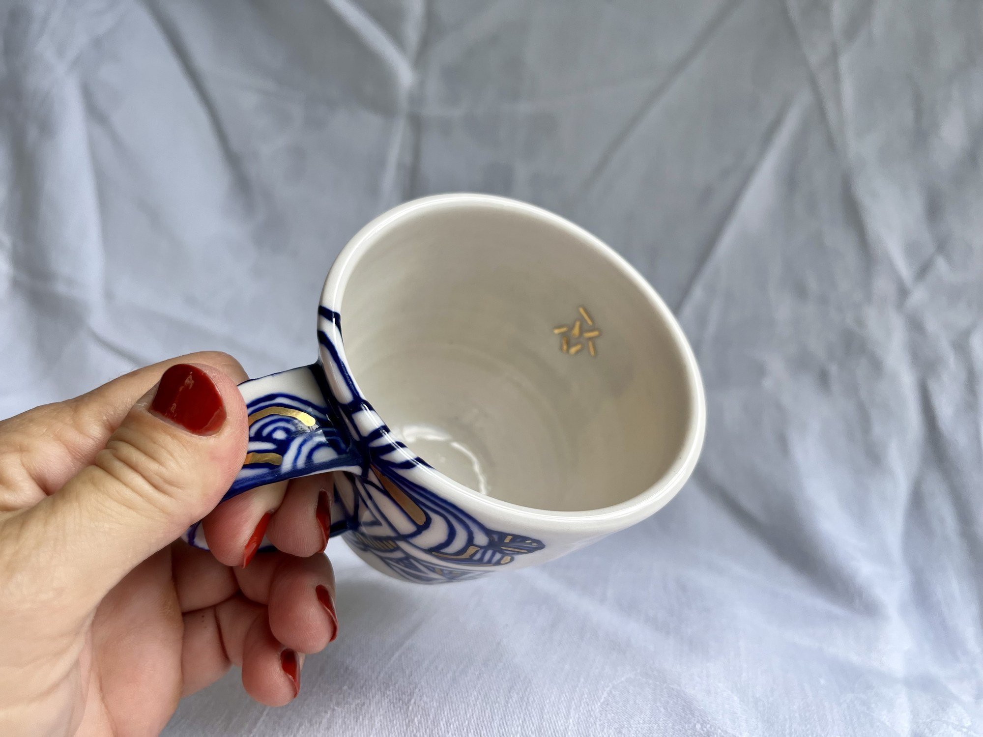 Interior of wheel-thrown porcelain mug No. 028, hand-painted in Naples, Florida