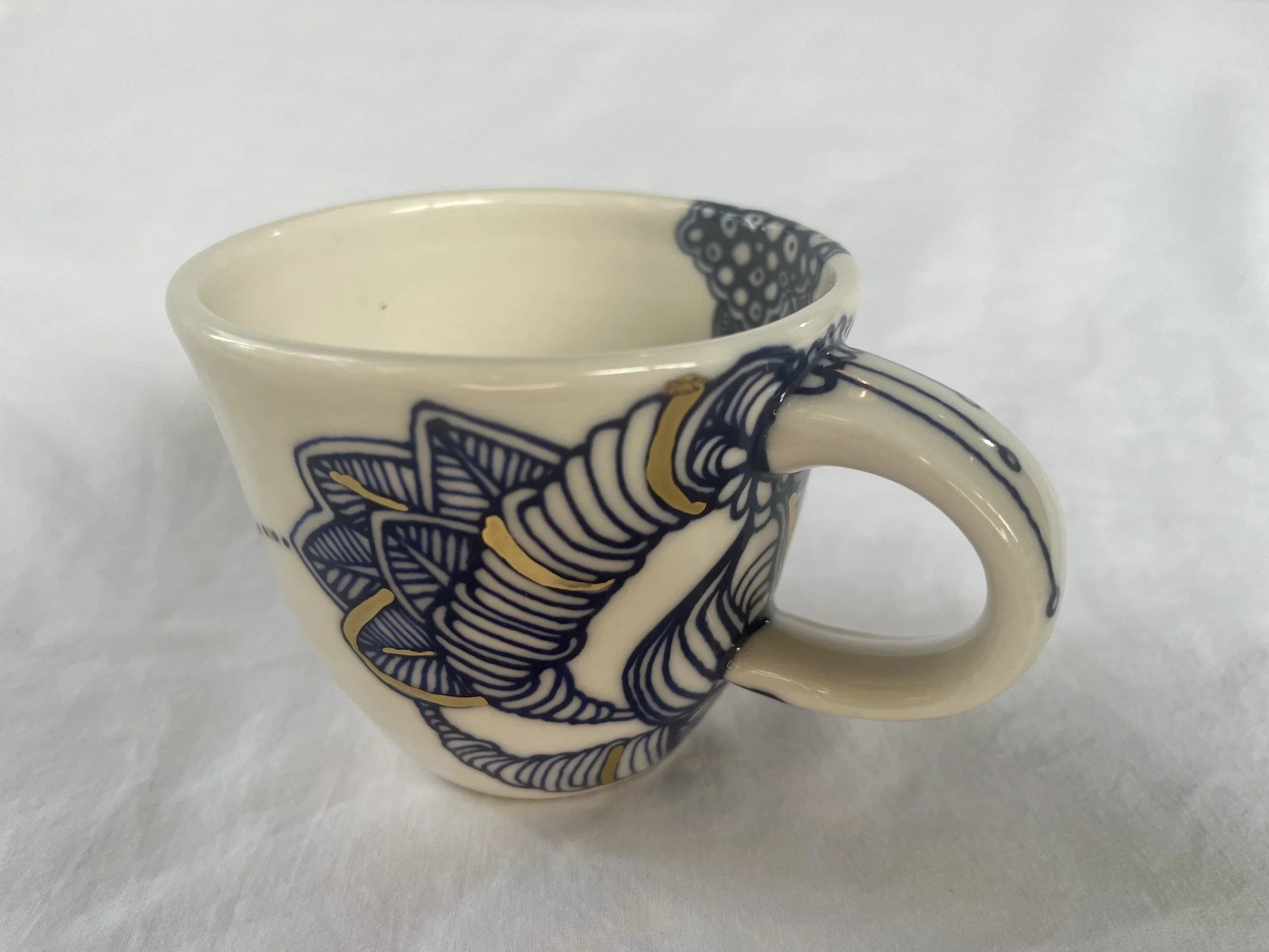 Cobalt blue line work and gold luster detail on handmade porcelain mug No. 020