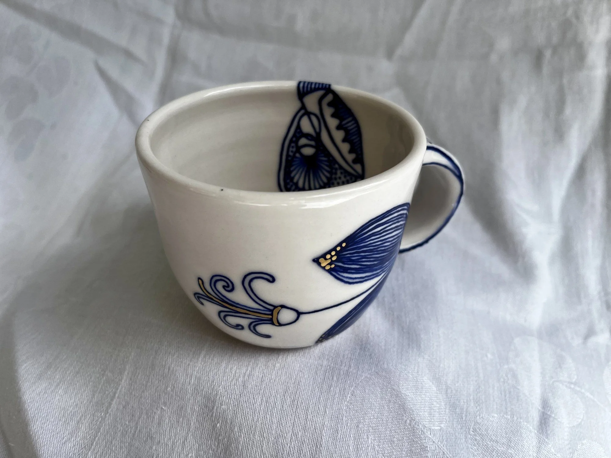 Interior of wheel-thrown porcelain mug No. 029, hand-painted in Naples, Florida