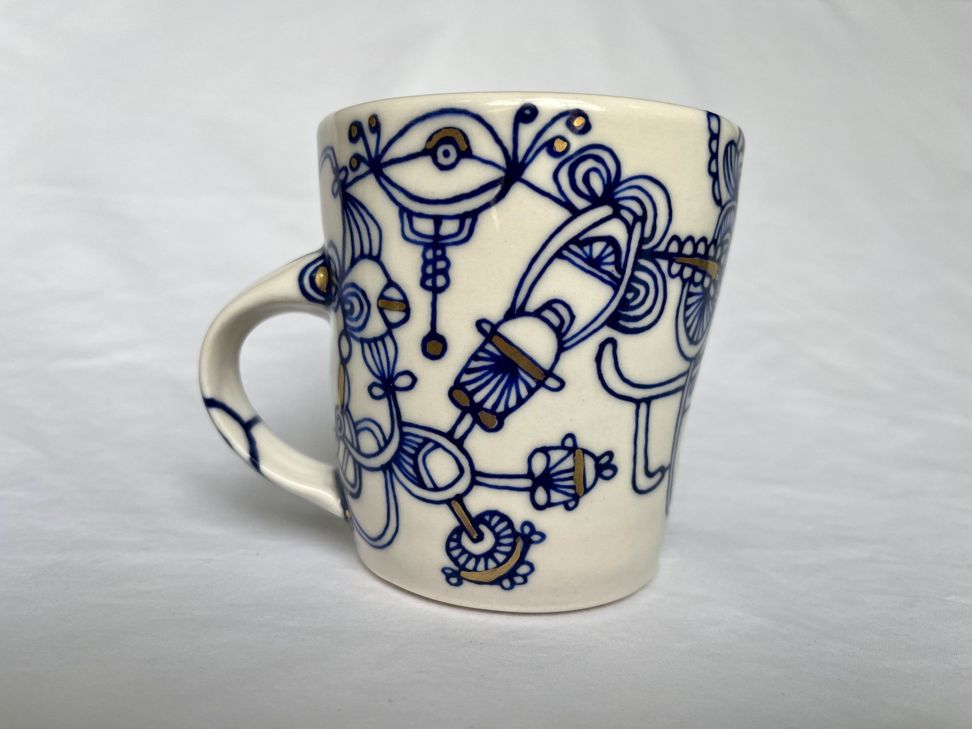 Cobalt blue line work and gold luster detail on handmade porcelain mug No. 013