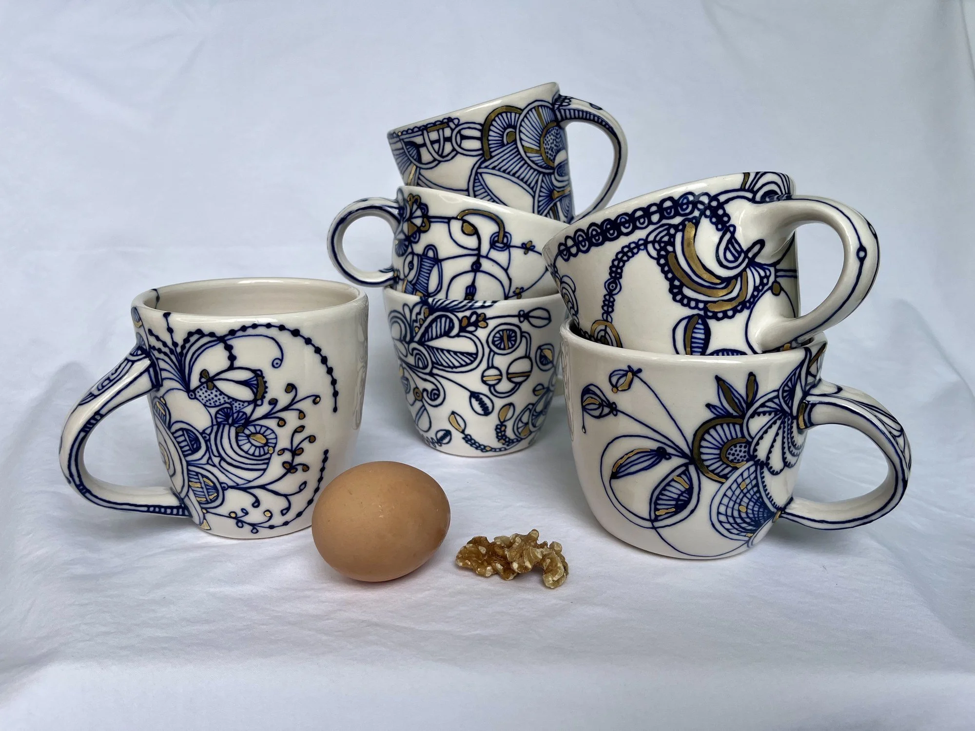 Hand-painted cobalt and gold luster mugs