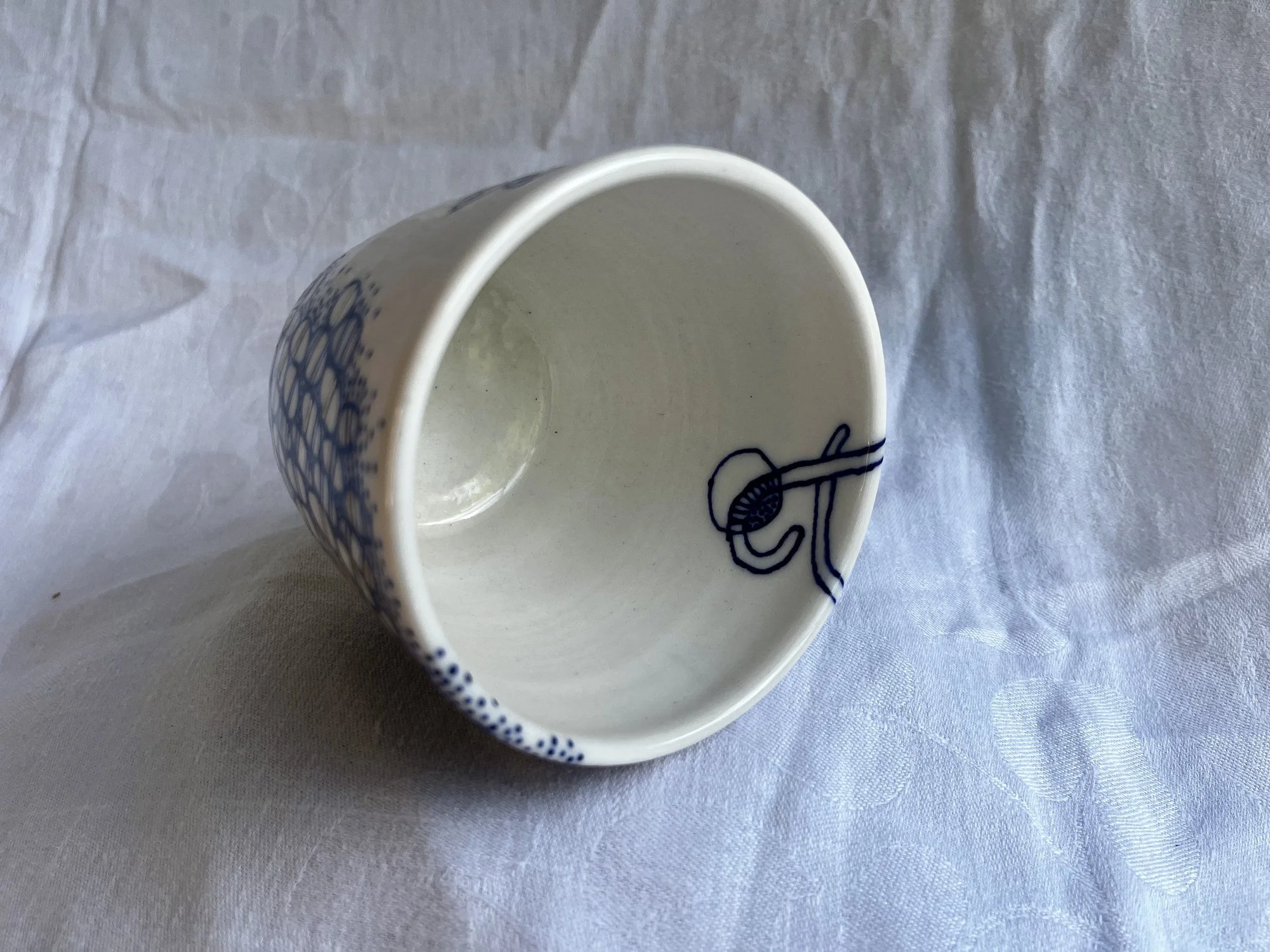 Interior of wheel-thrown porcelain tumbler No. 001, hand-painted in Naples, Florida