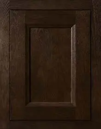 Close-up of a wooden cabinet door with a recessed panel.