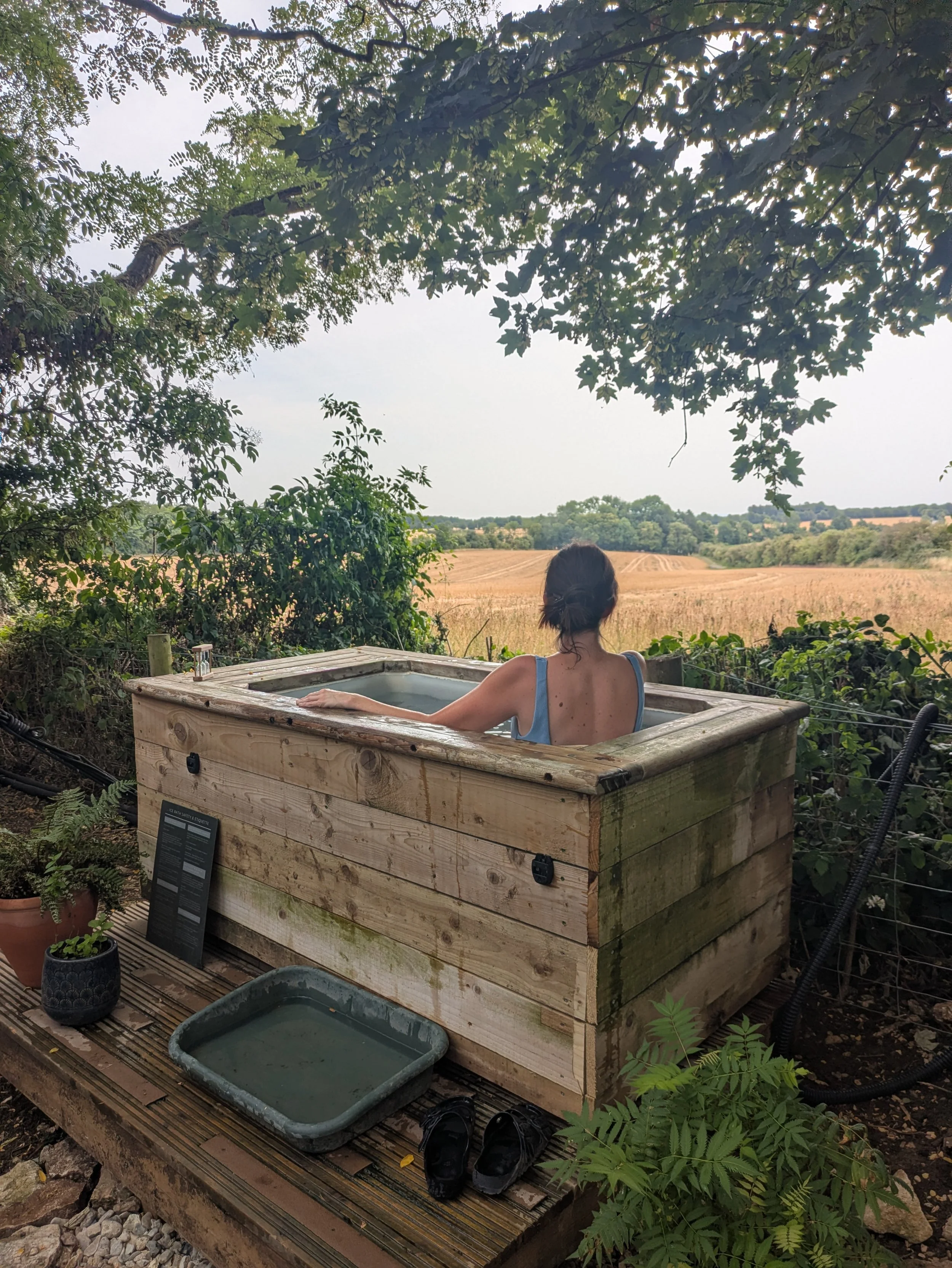 Outdoor cold plunge overlooking the Cotswolds countryside
