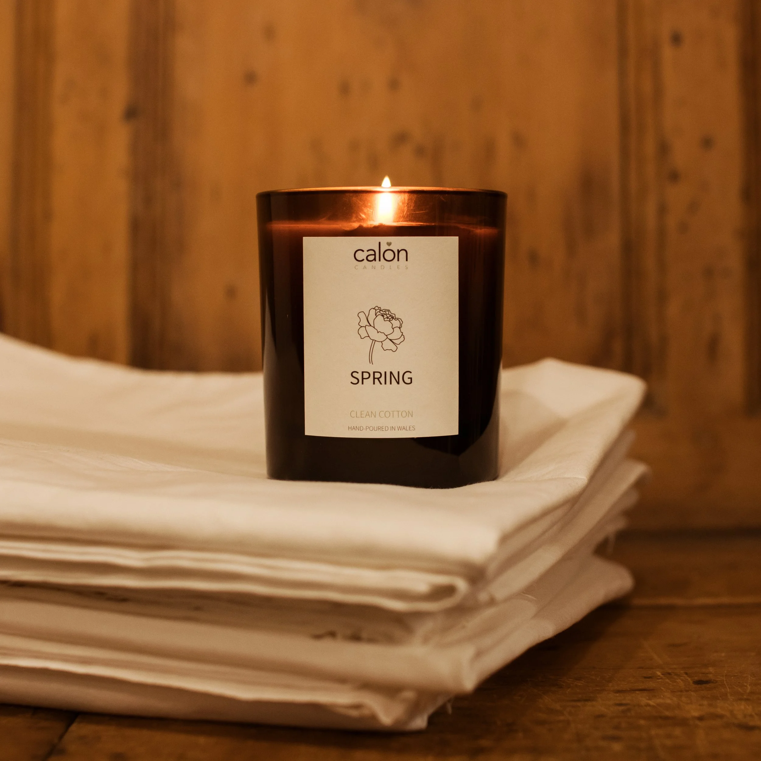clean cotton spring candle on fresh sheets.jpg