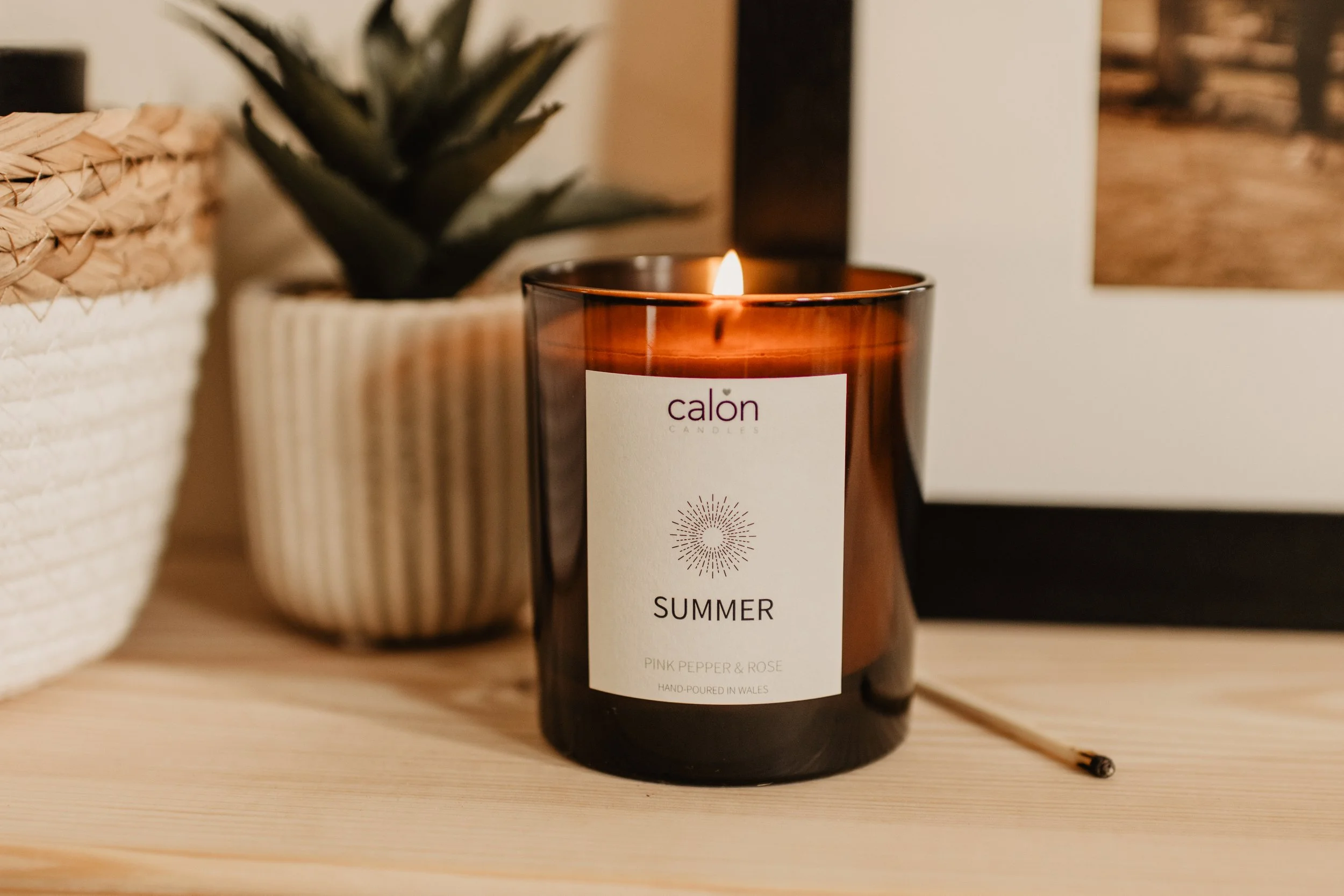 Pink pepper and rose summer candle on shelf.jpg