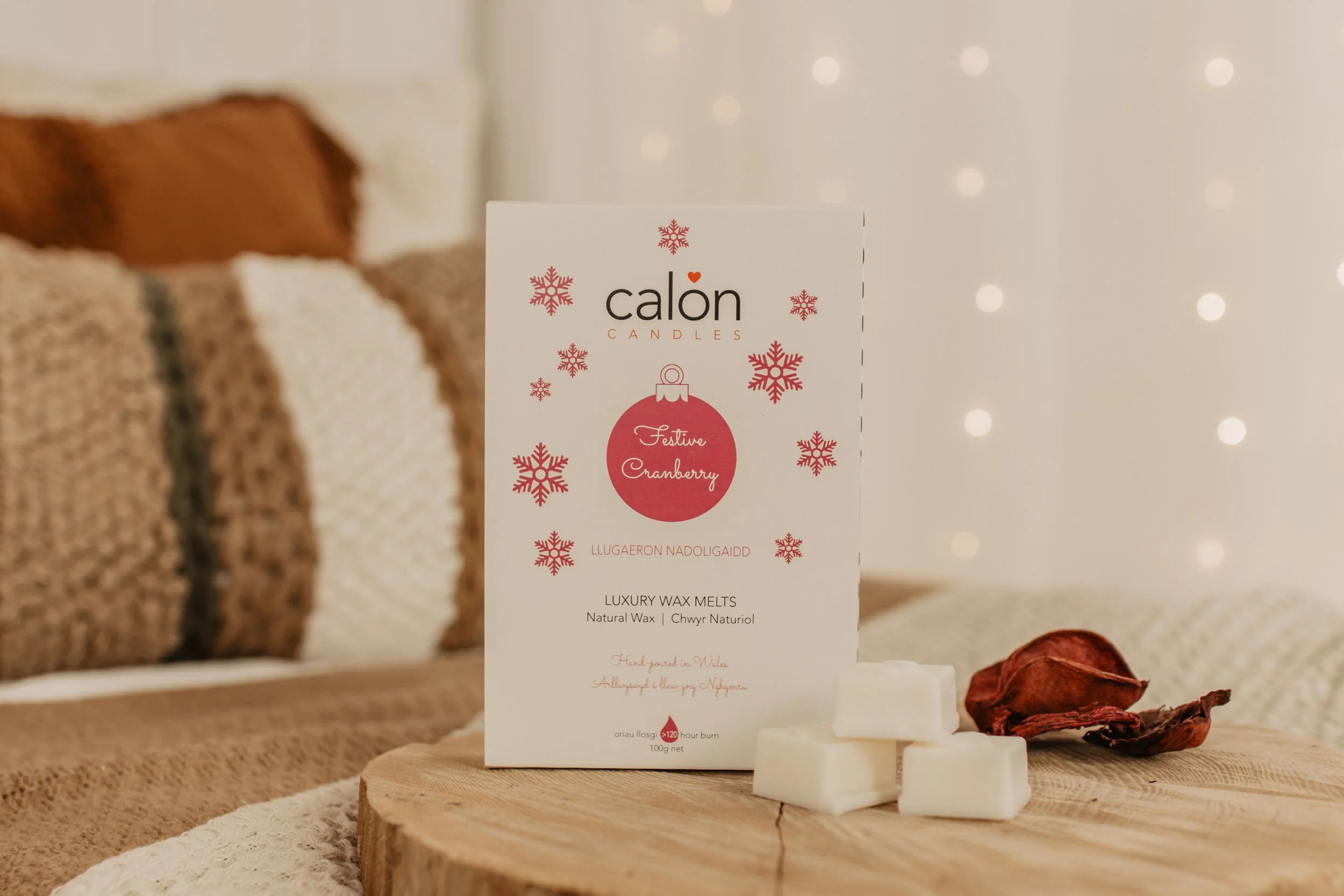 Festive cranberry wax melts on wooden board.jpg