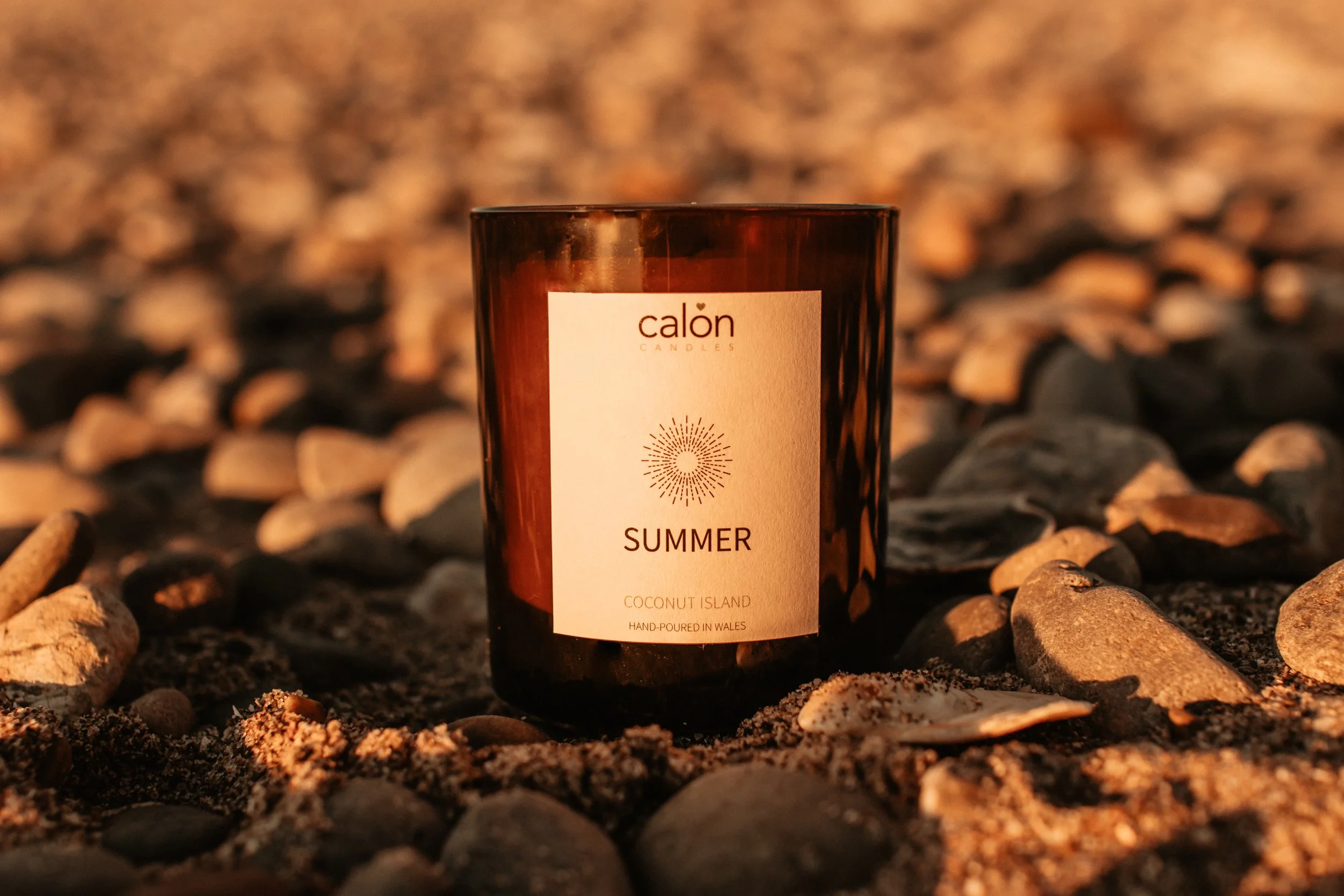 Coconut Island summer candle in sand.jpg