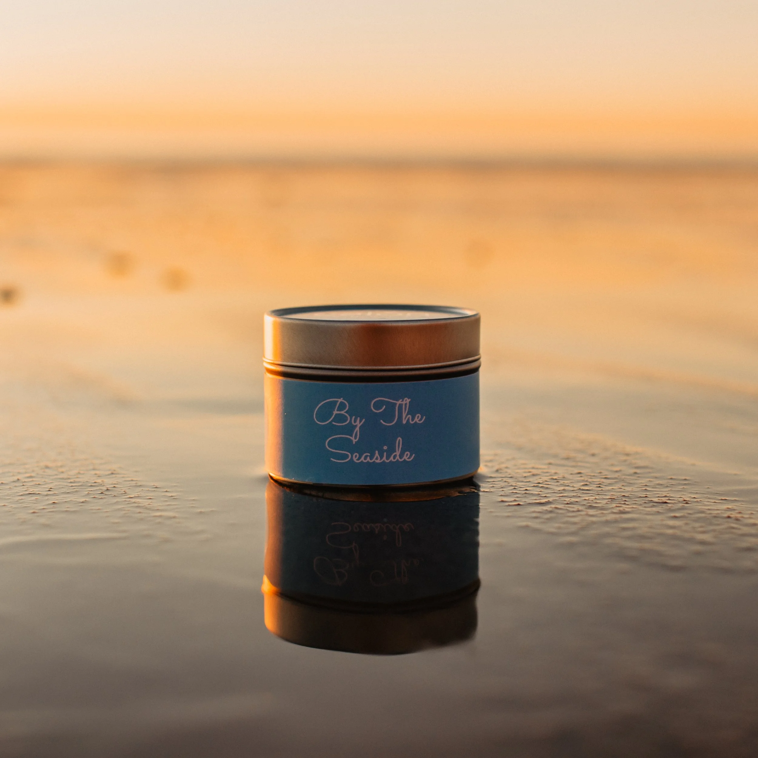 By the Seaside mini tin candle on beach.jpg