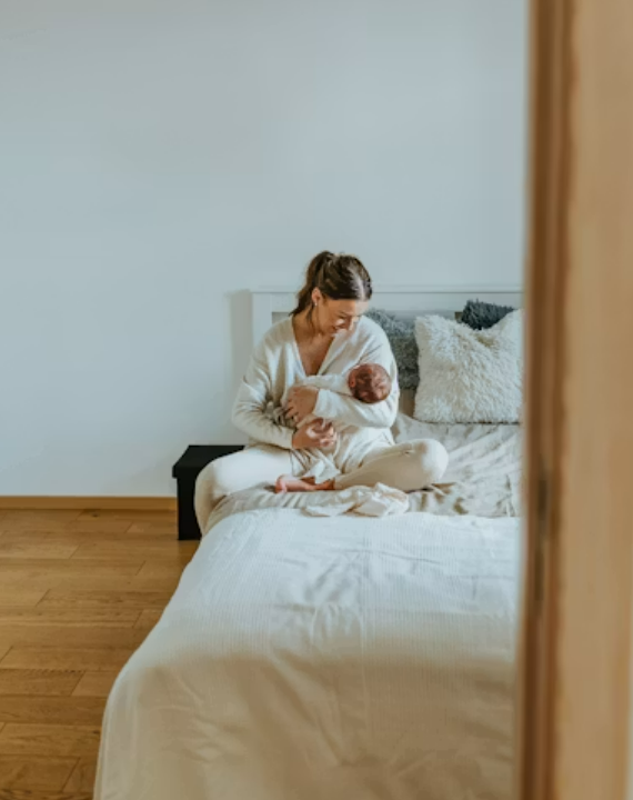 a postpartum mother and her new baby