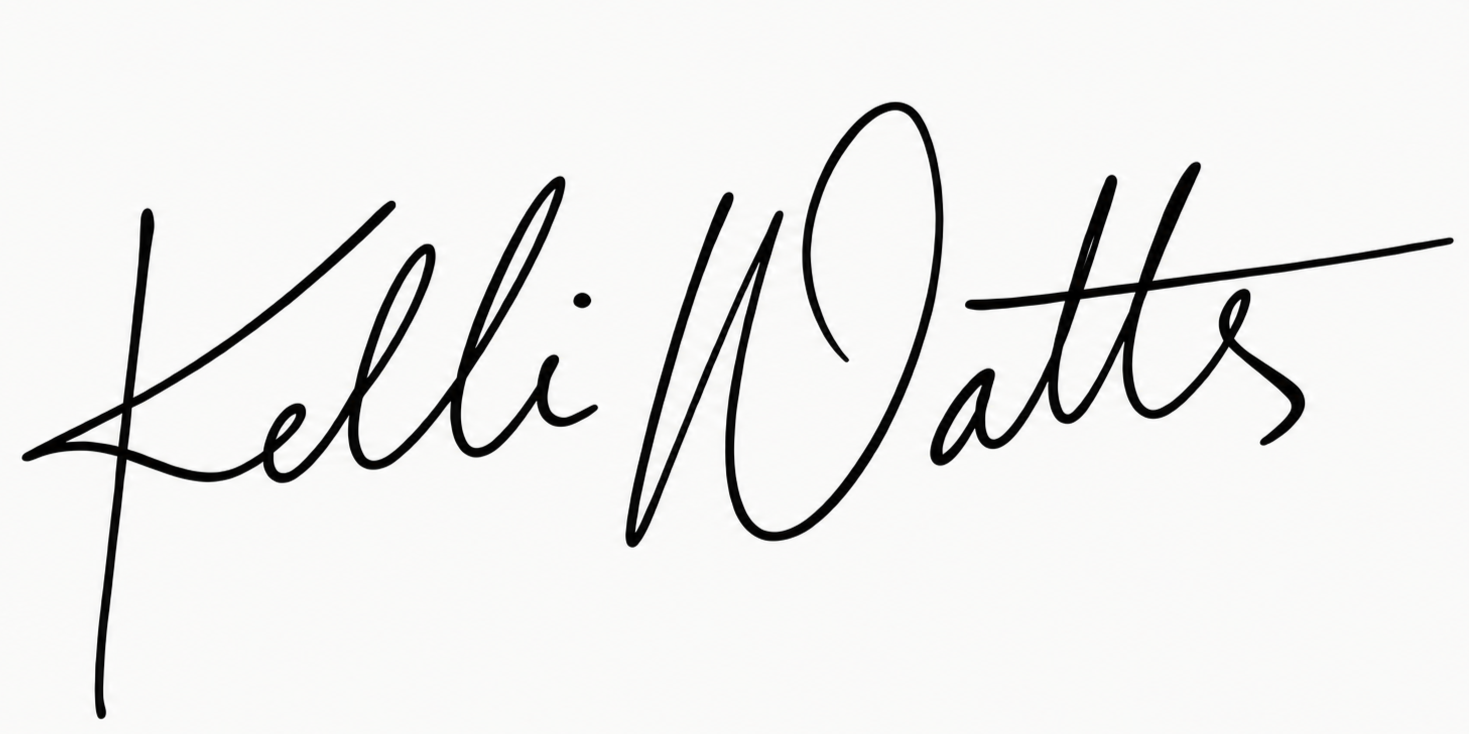 Black handwritten calligraphy reading “Kellie Watts” on a white background