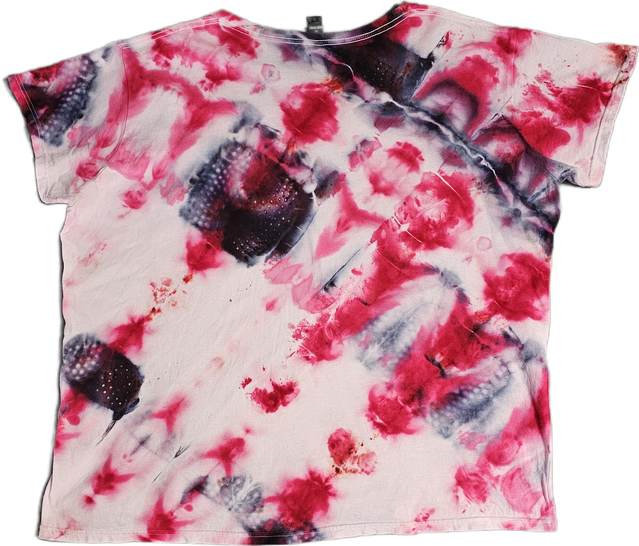 A cotton t-shirt with a pink, red, black, and white tie-dye pattern.