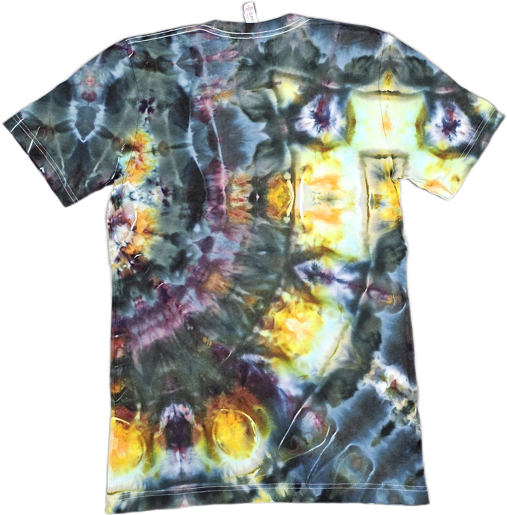 Bella + Canvas  T-shirt with a colorful abstract pattern resembling a watercolor painting with various dark and bright patches, including yellow, blue, purple, and black.