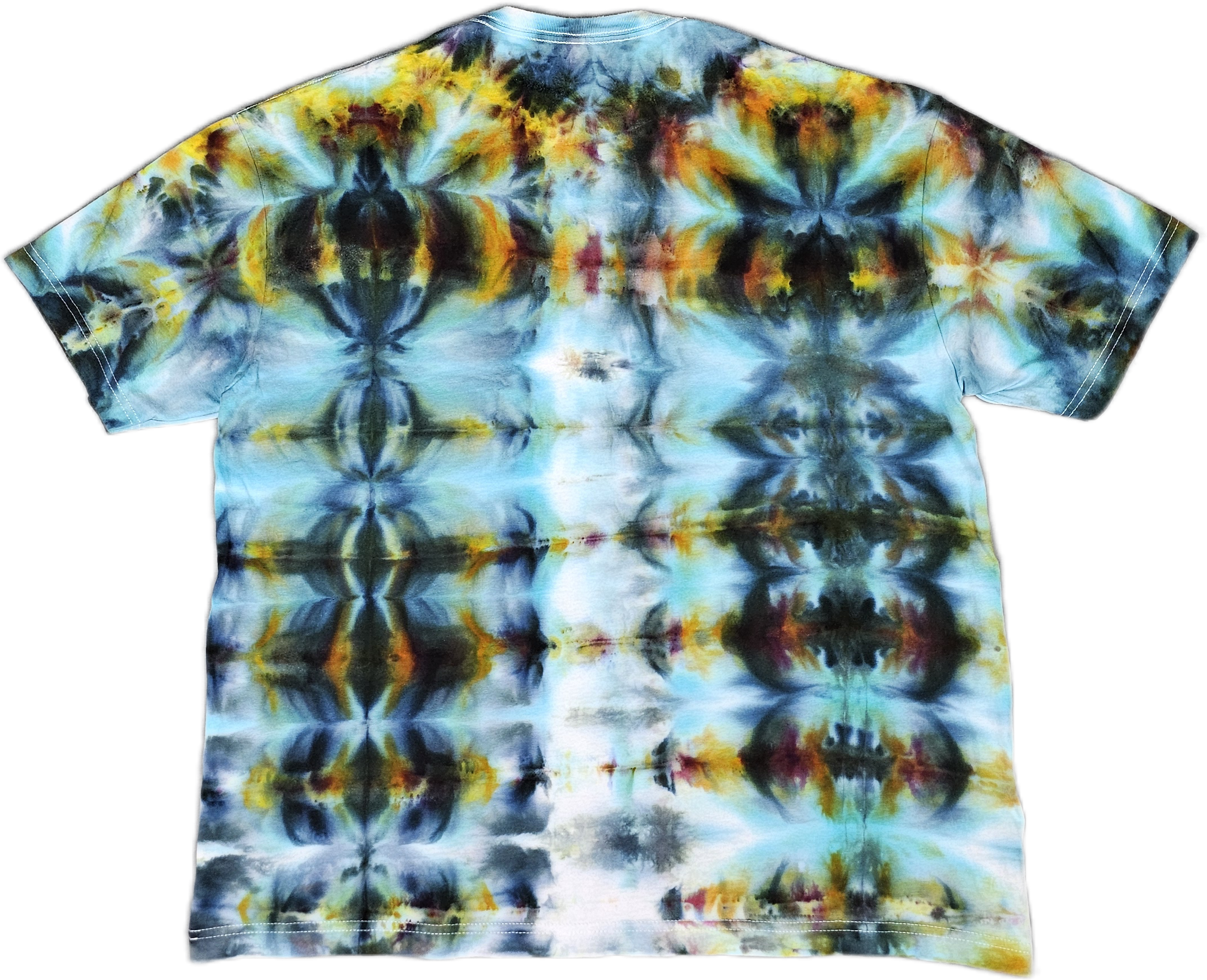 A Bella + Canvas  tie-dye fabric featuring a symmetrical, abstract pattern with shades of yellow, orange, black, blue, and white, resembling floral or kaleidoscopic designs.